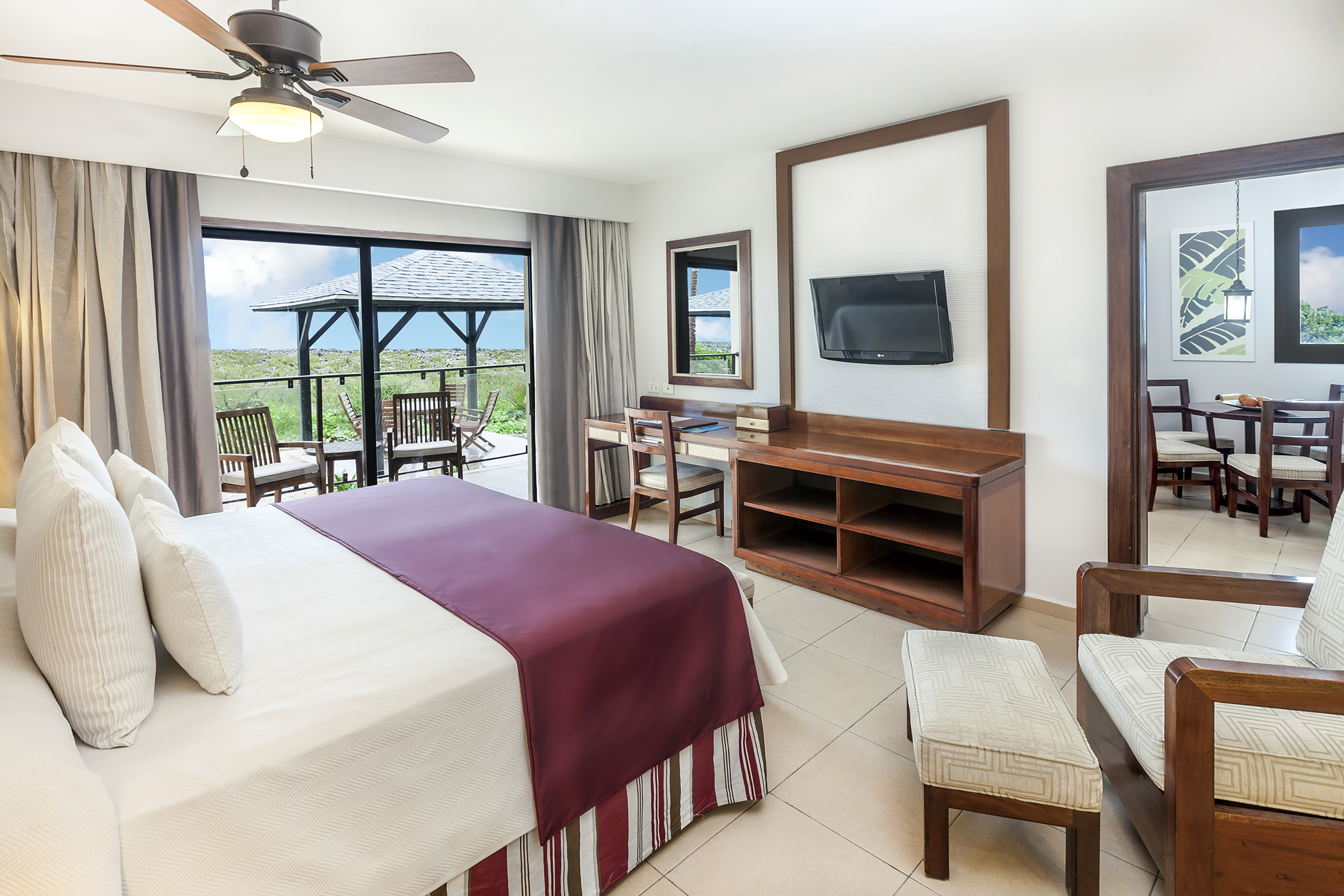 a room with a bed and a television