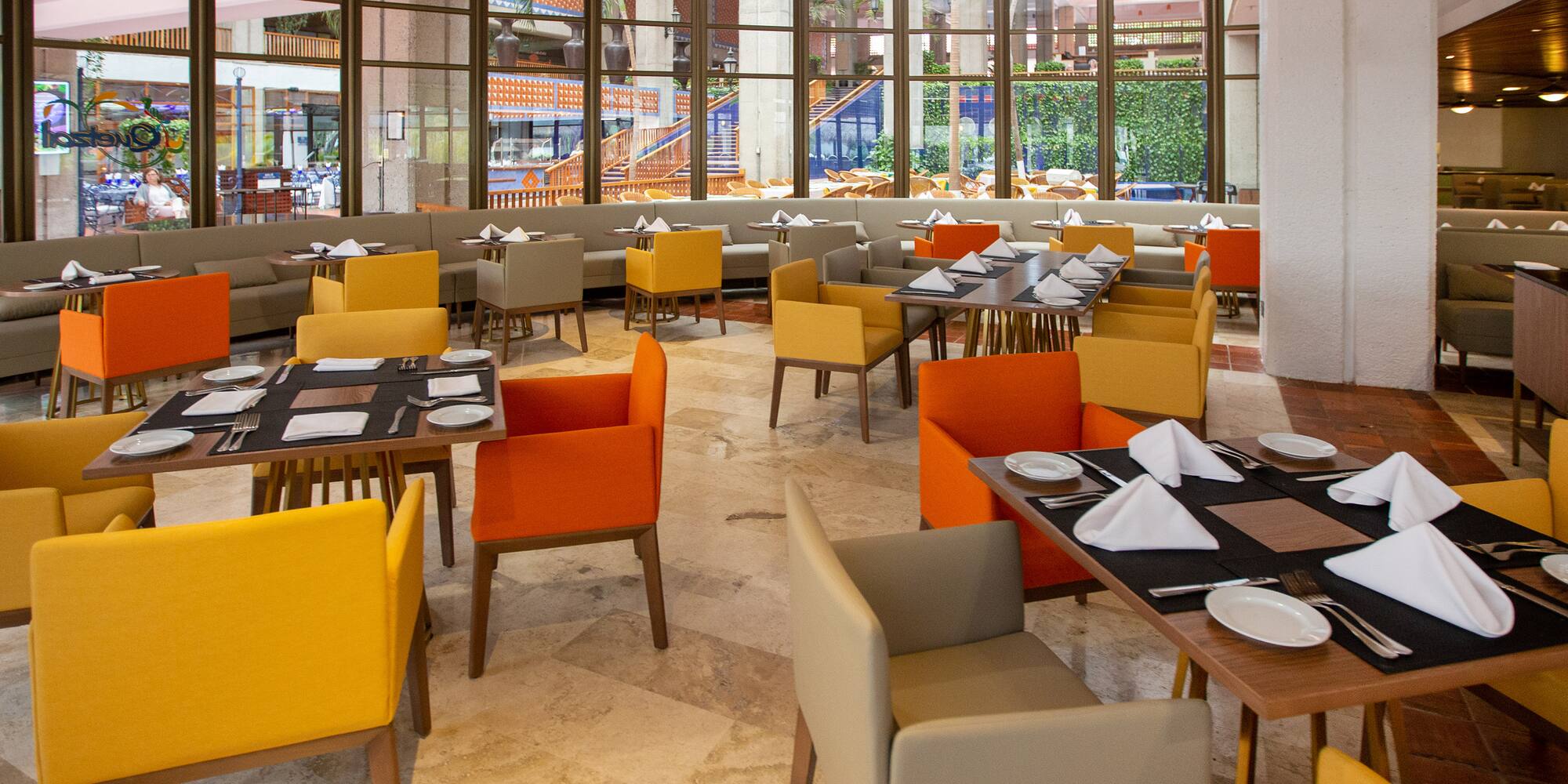 a restaurant with tables and chairs