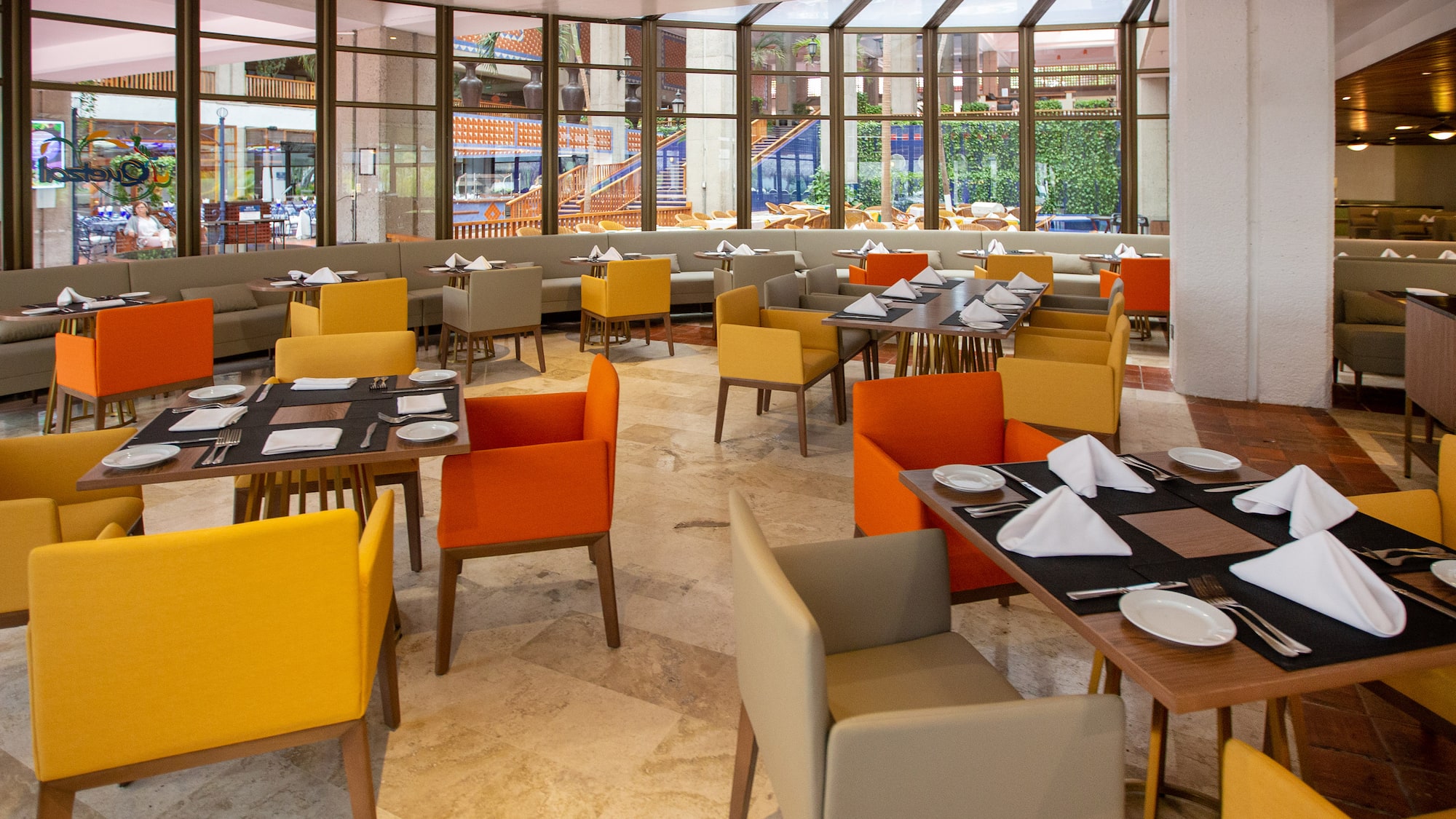 a restaurant with tables and chairs