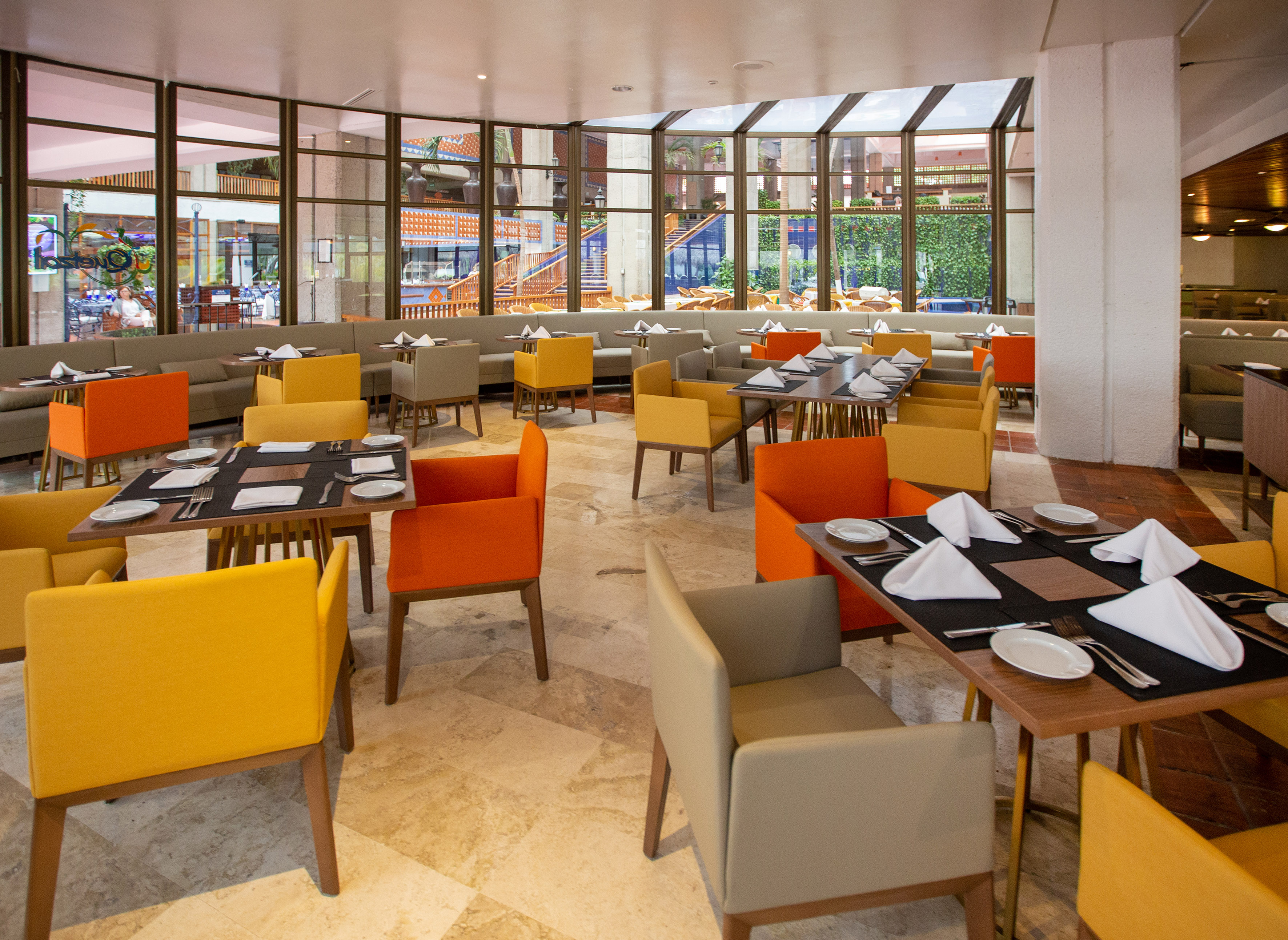 a restaurant with tables and chairs