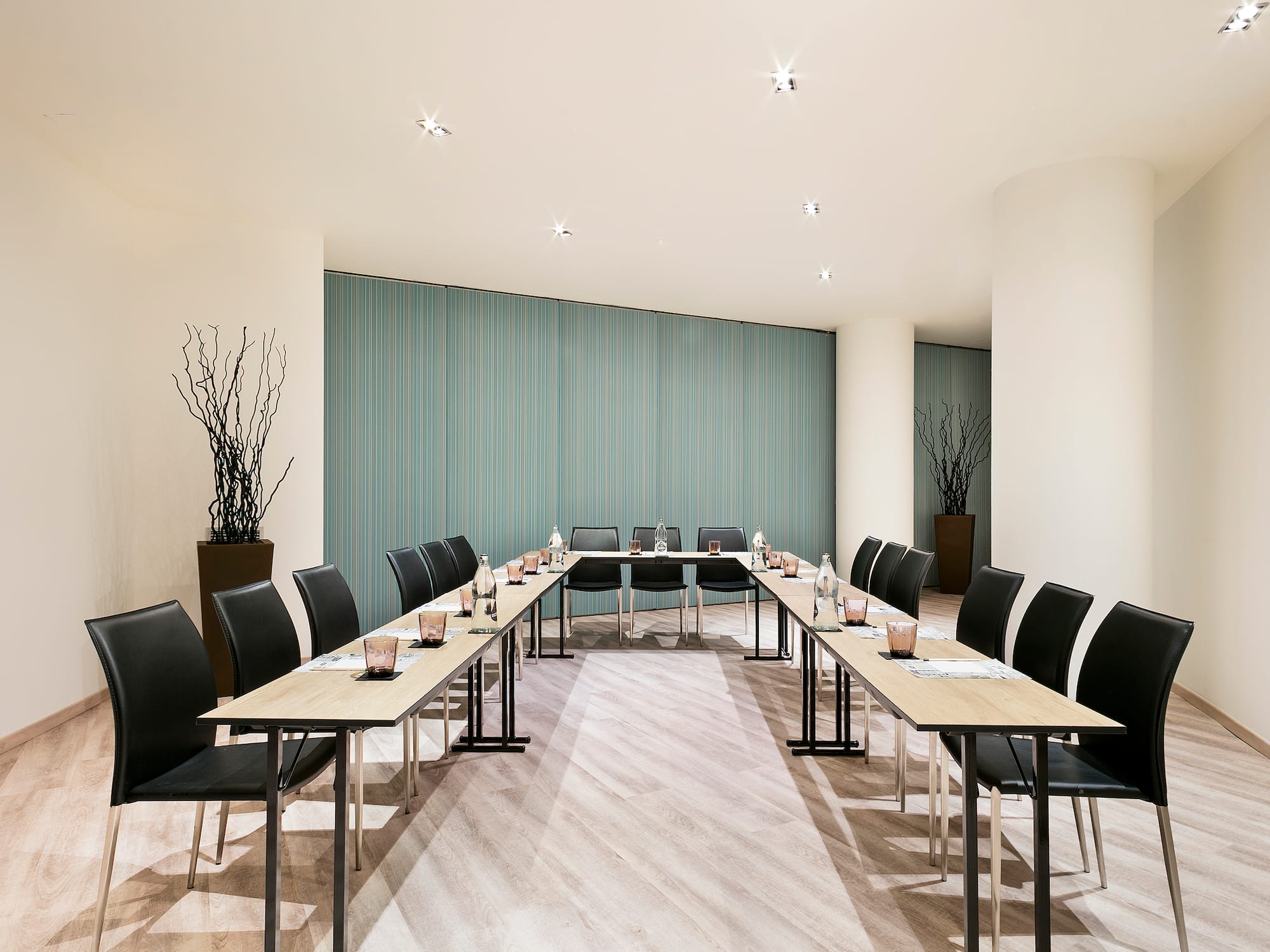 a room with long tables and chairs