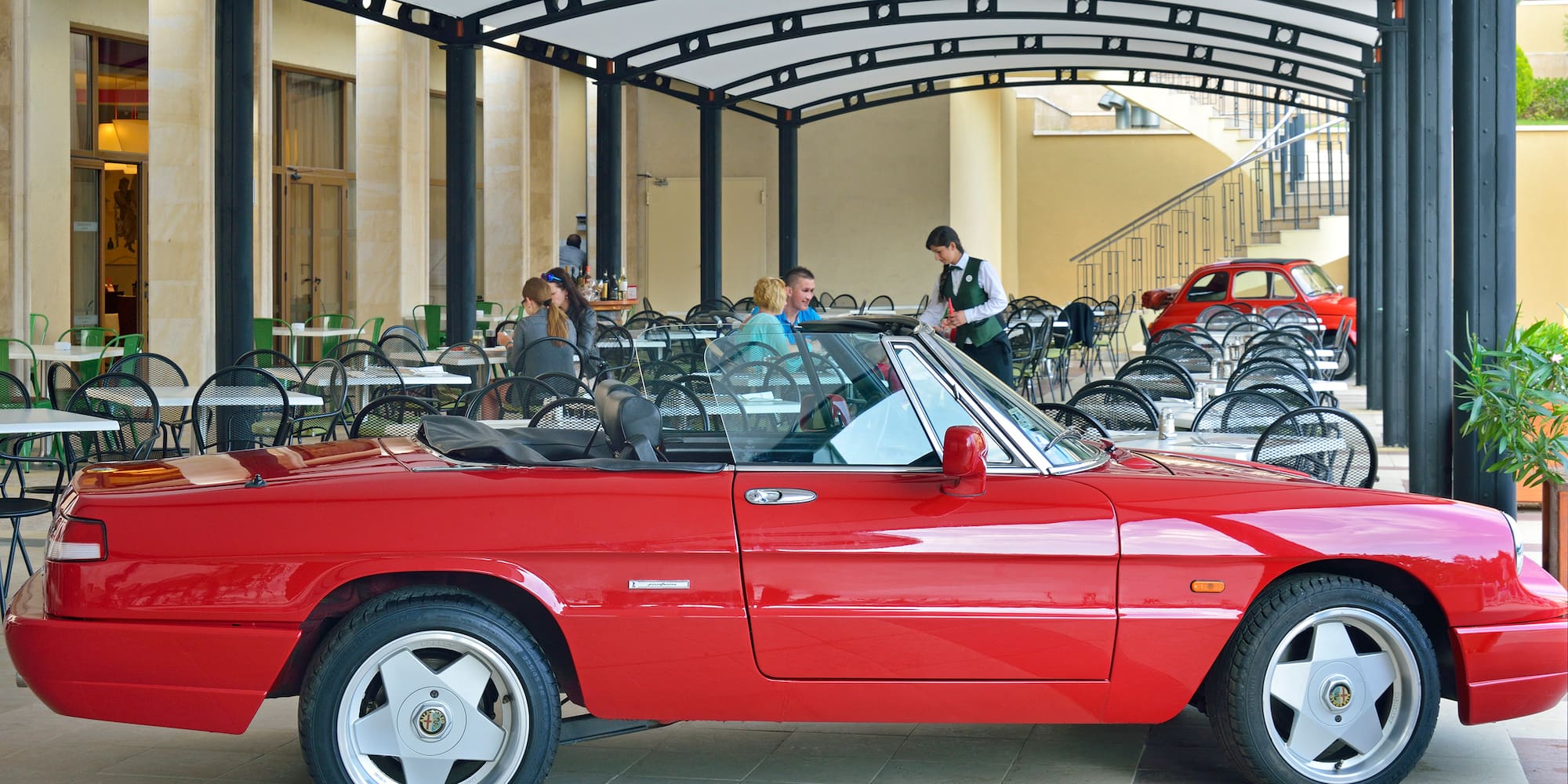 a red car parked in a restaurant