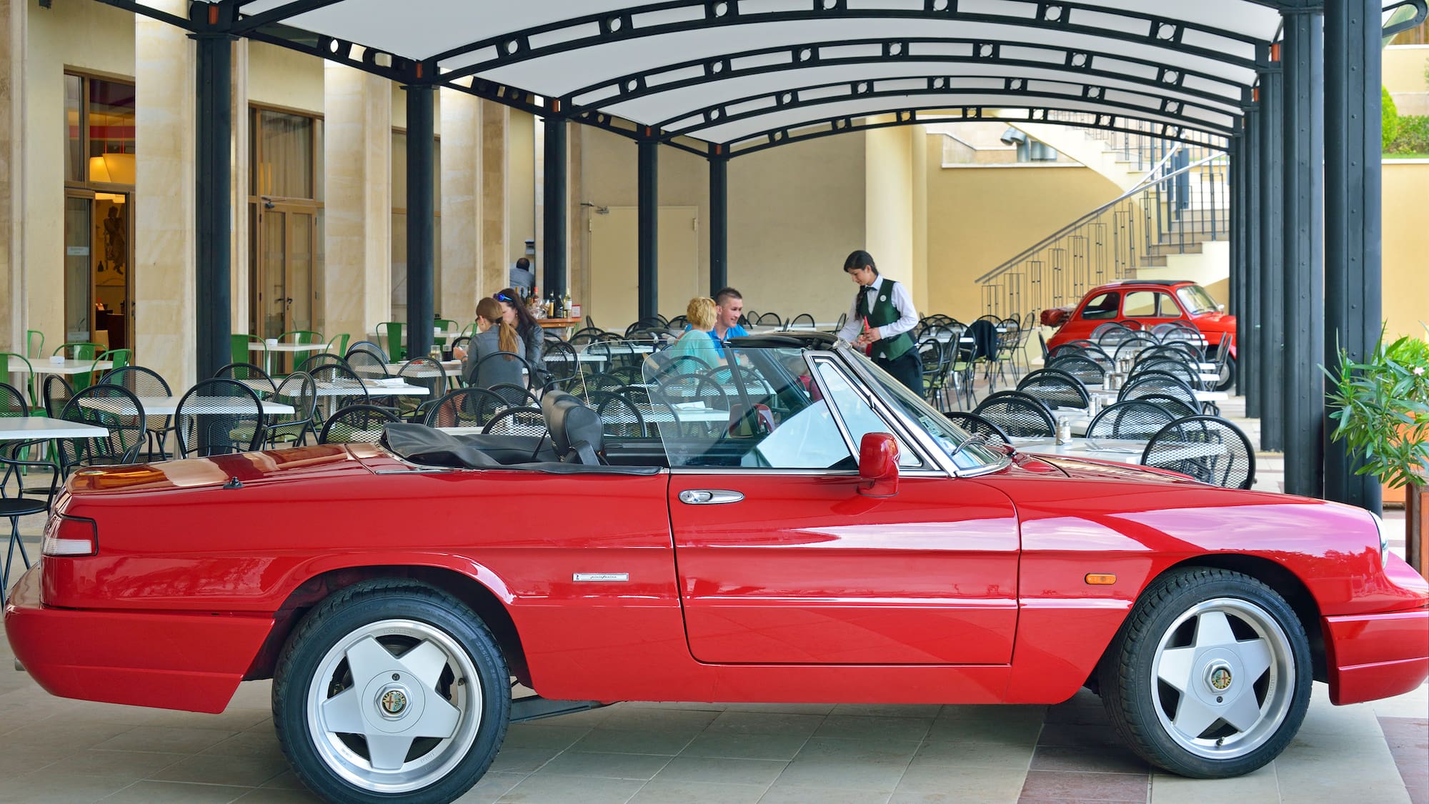 a red car parked in a restaurant