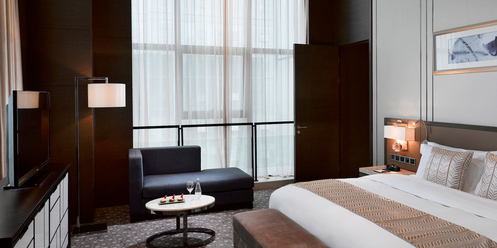 a room with a bed and a chair