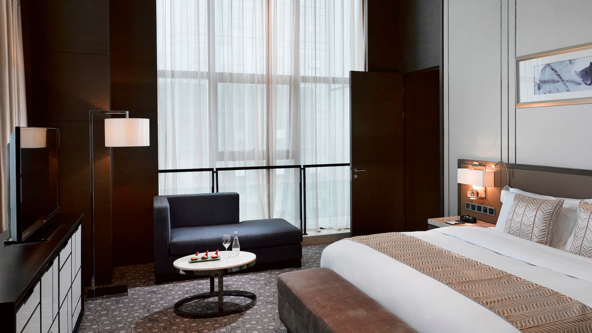 a room with a bed and a chair