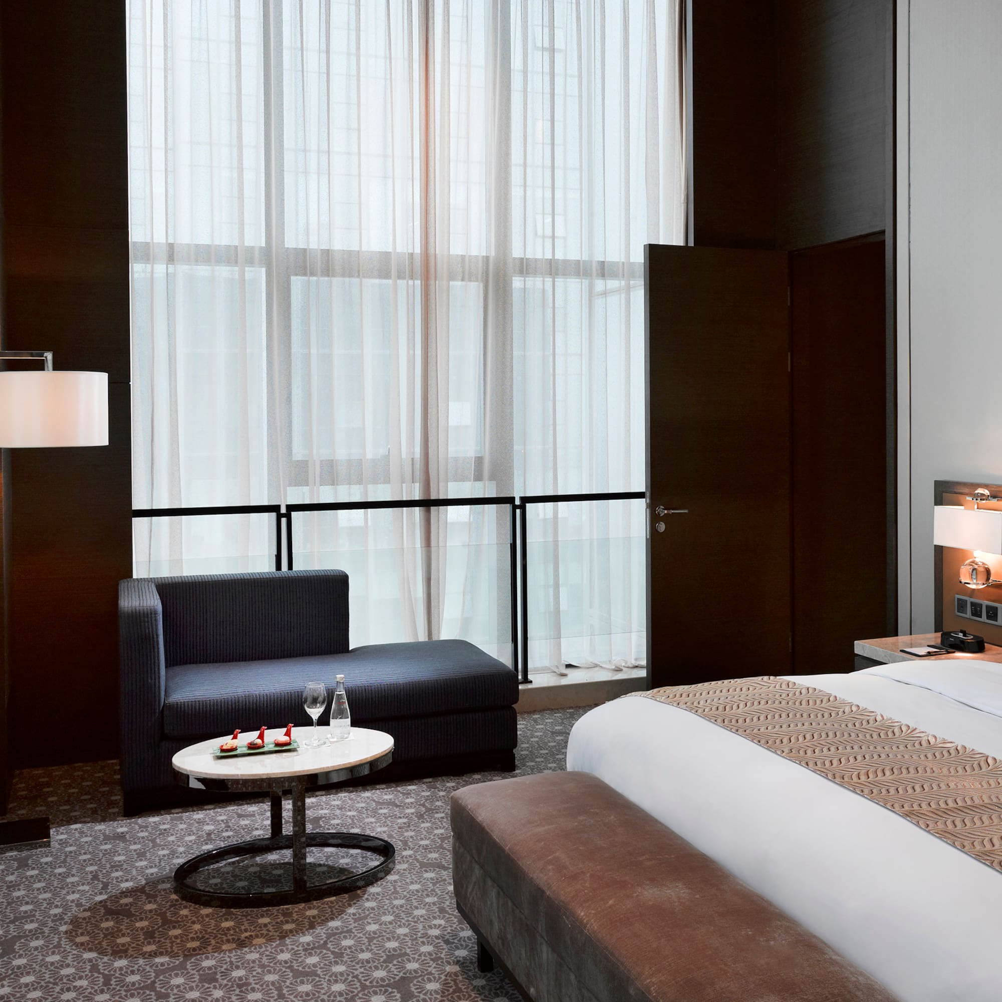 a room with a bed and a chair