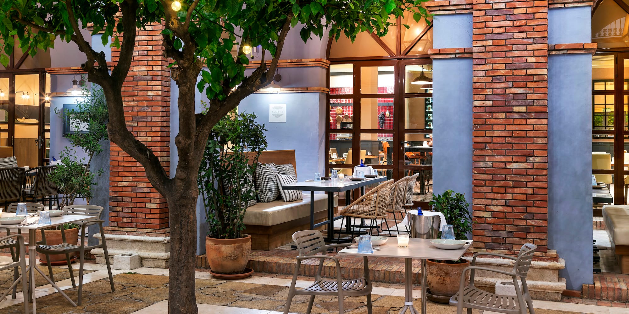 a table and chairs outside a building