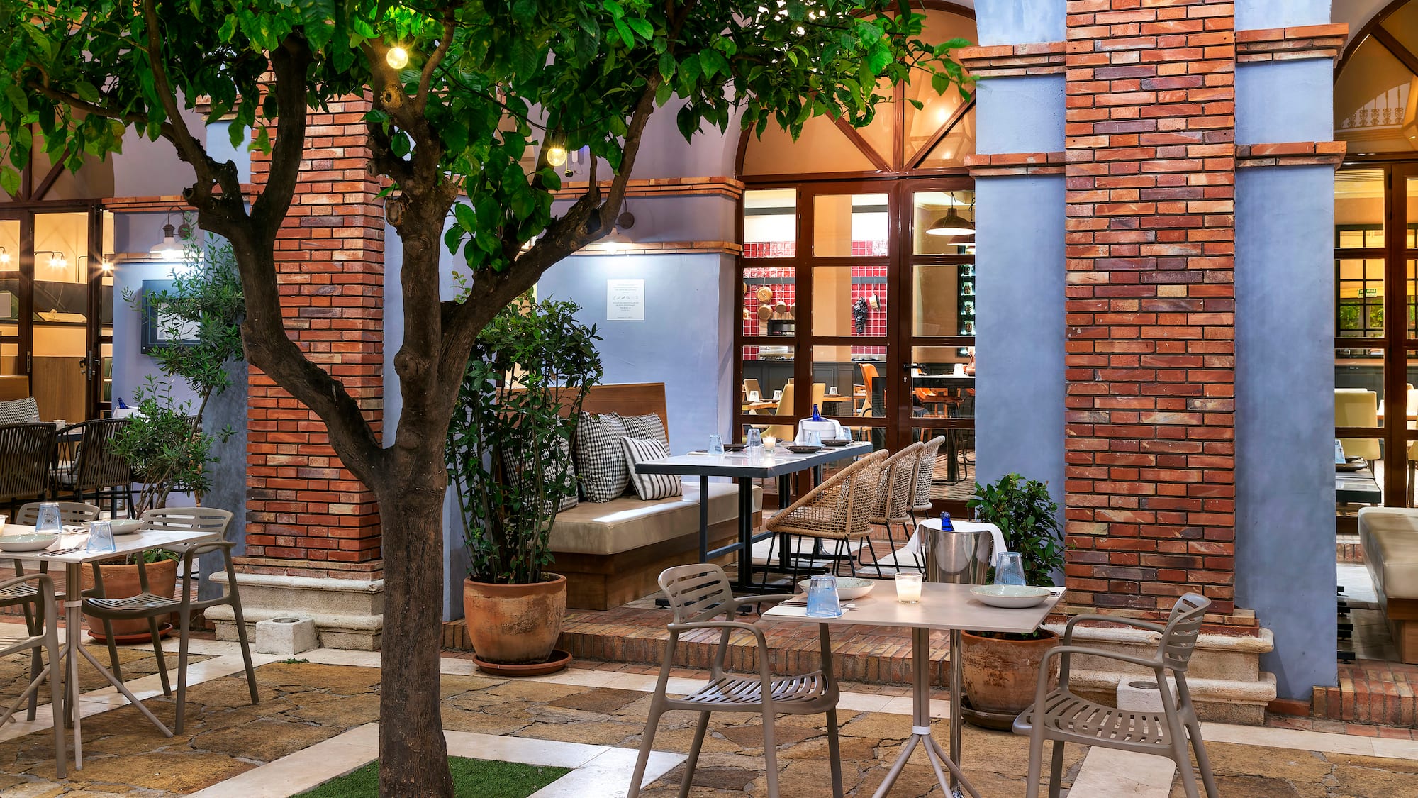 a table and chairs outside a building