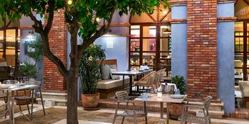 a table and chairs outside a building