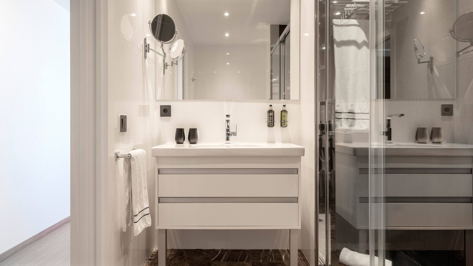 a bathroom with a mirror and sink