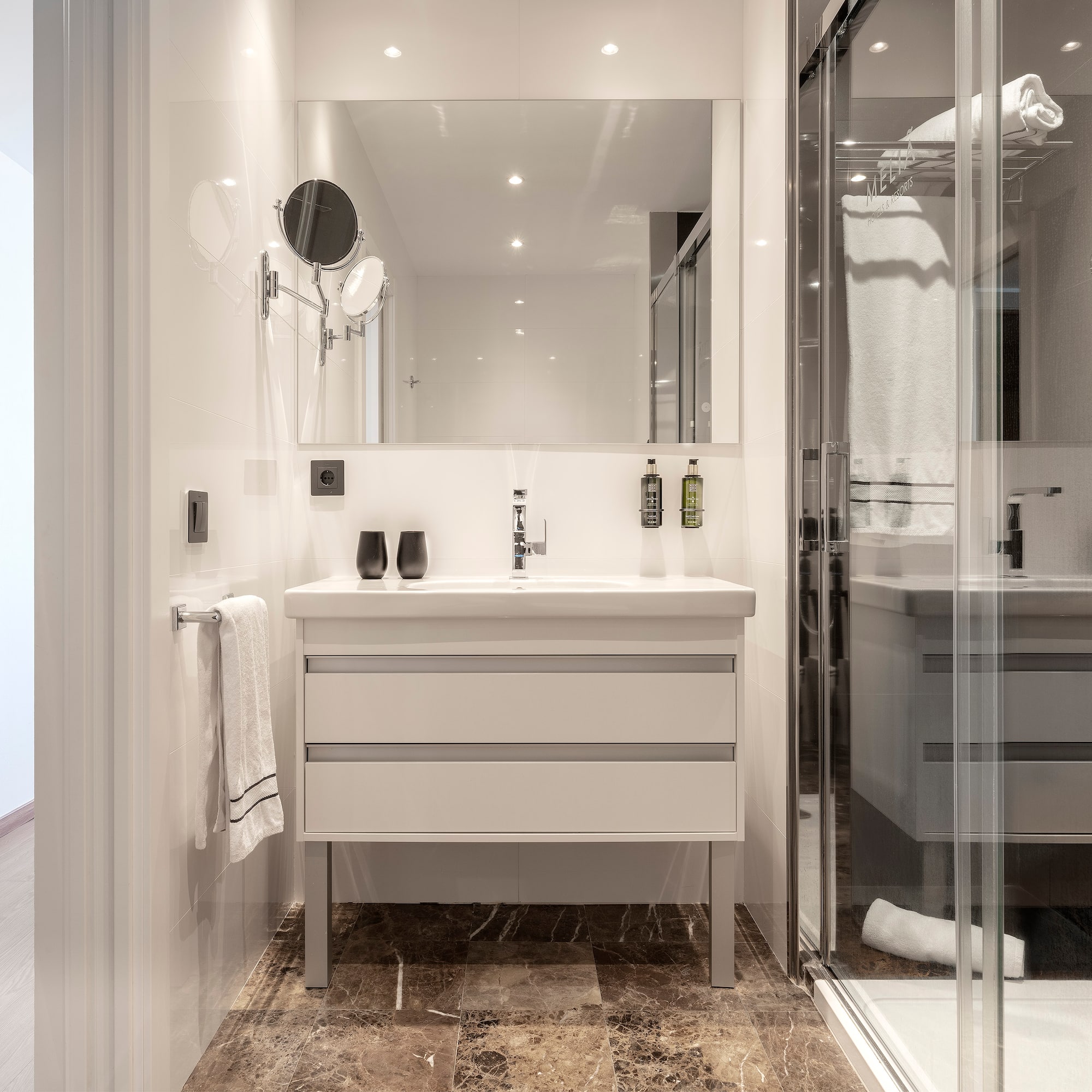 a bathroom with a mirror and sink