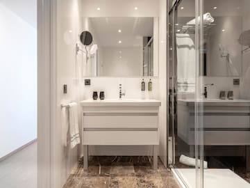 a bathroom with a mirror and sink