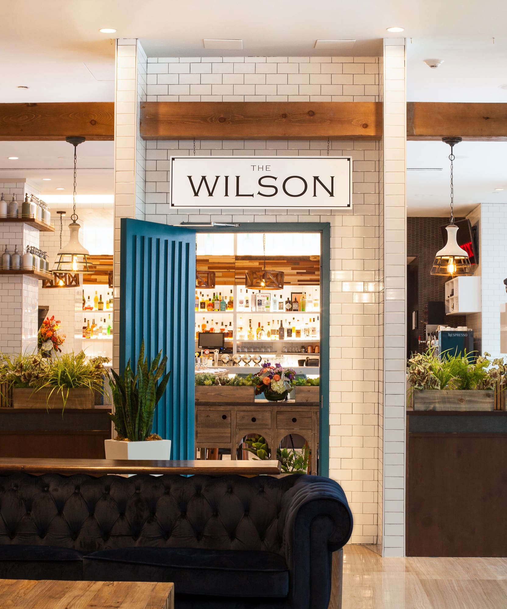 a room with a blue door and a blue couch