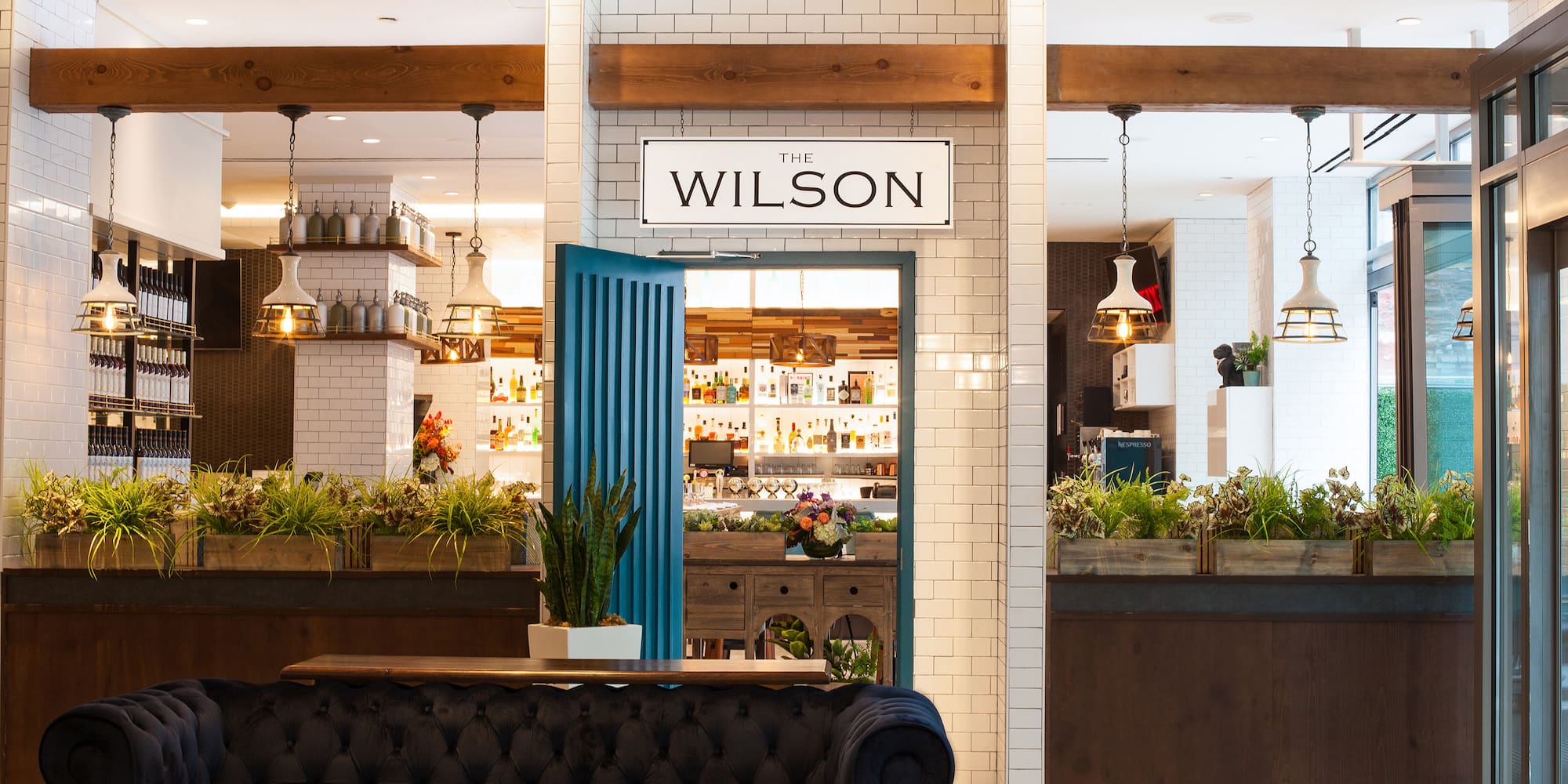 a room with a blue door and a blue couch