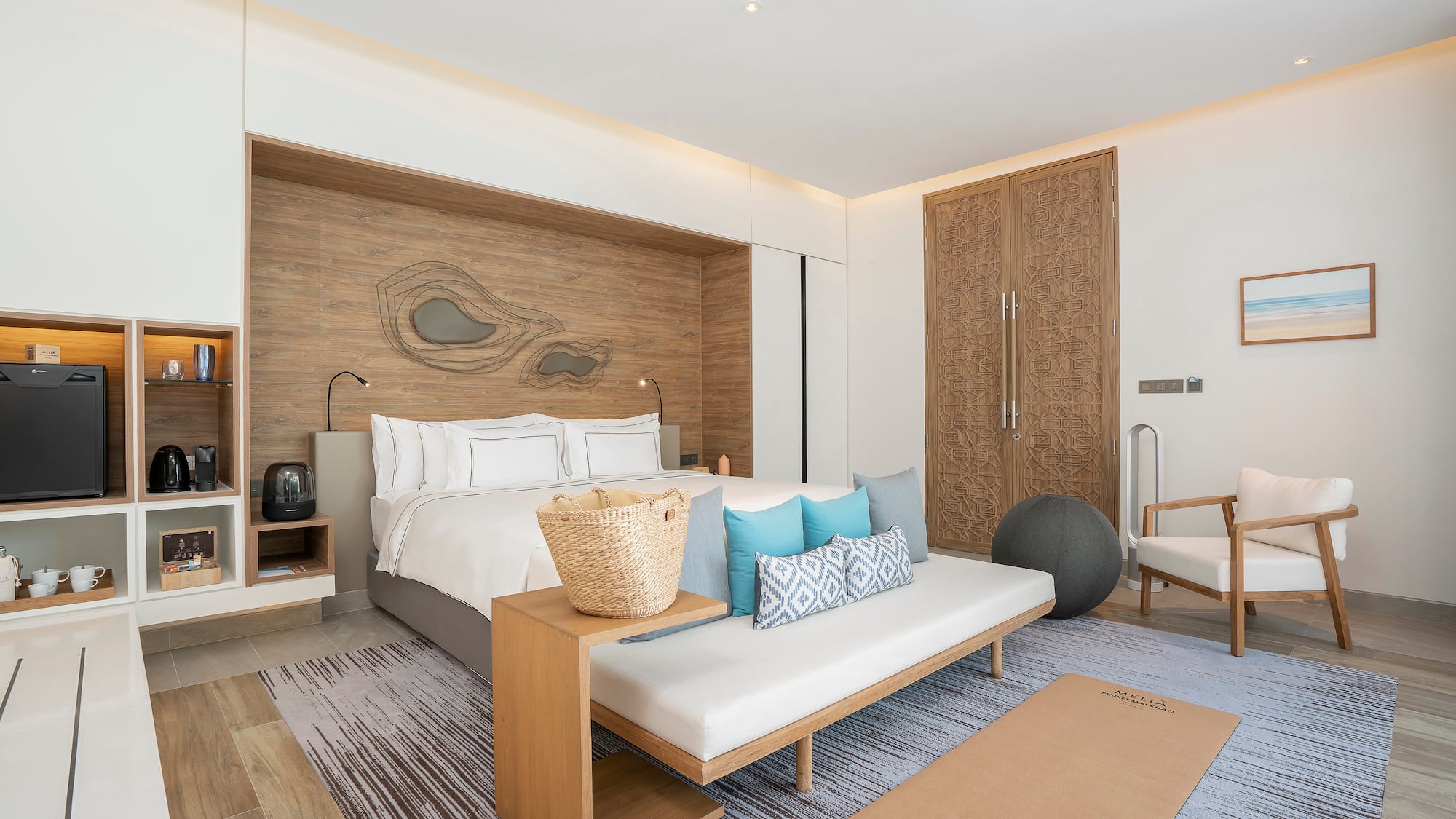 a room with a bed and a fan