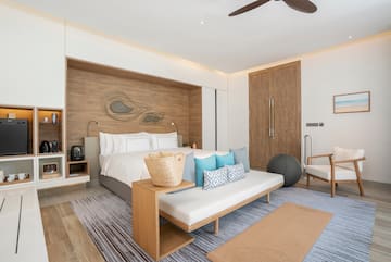 a room with a bed and a fan