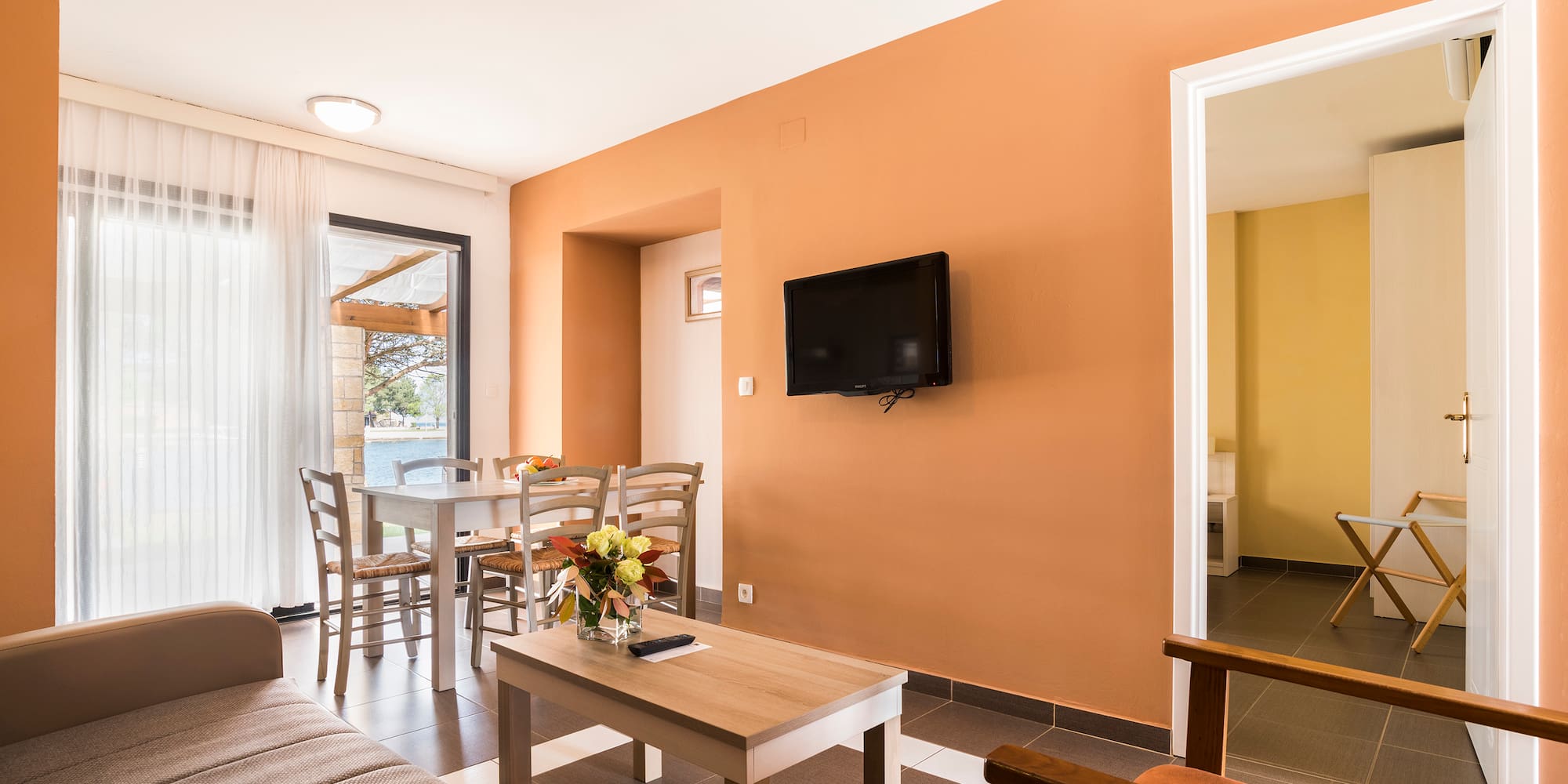 a living room with a tv and table