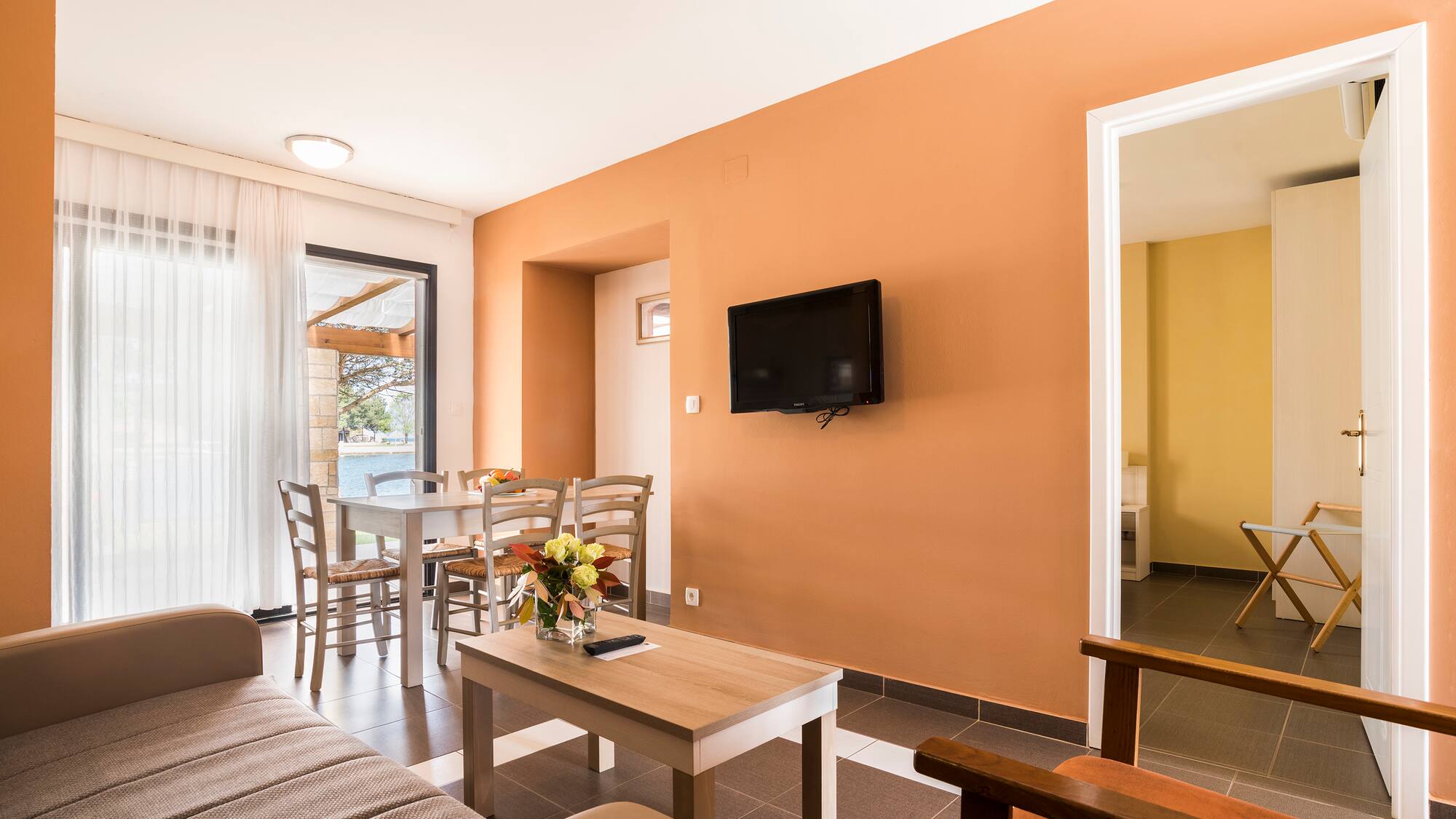 a living room with a tv and table