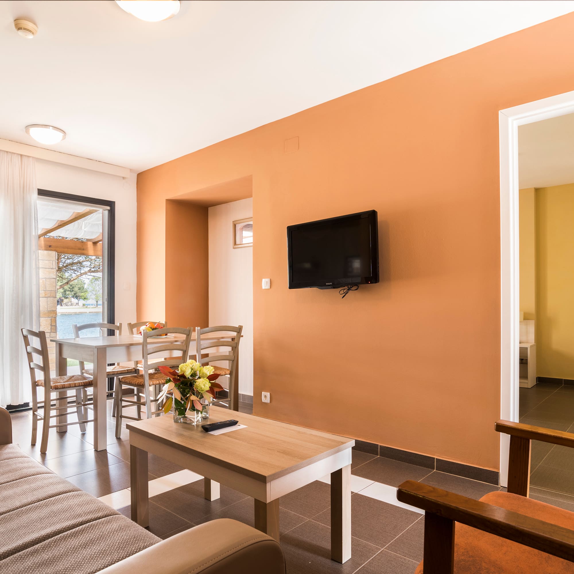 a living room with a tv and table