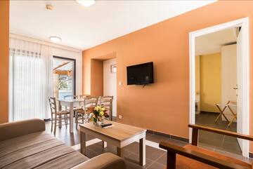 a living room with a tv and table