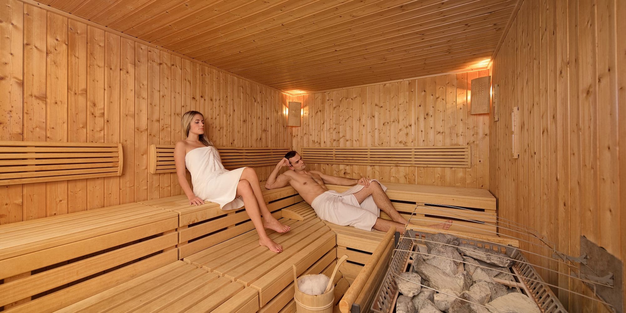 a man and woman in a sauna