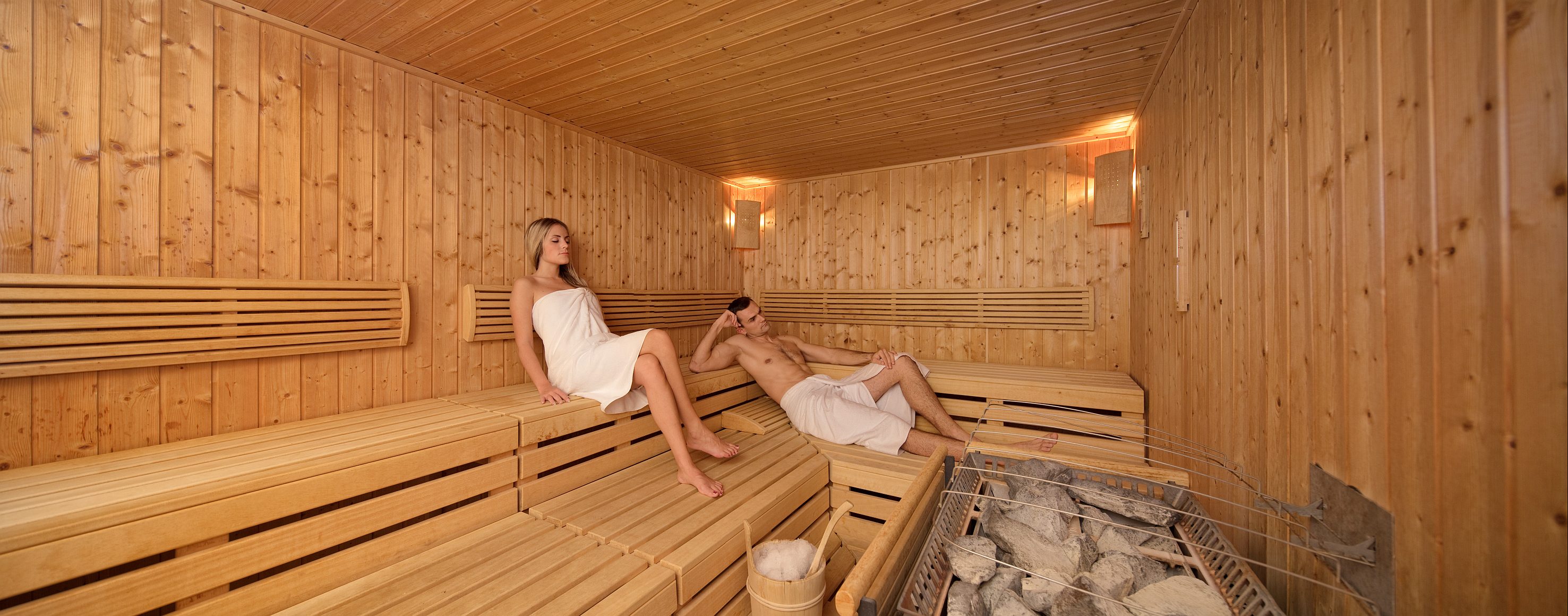 a man and woman in a sauna