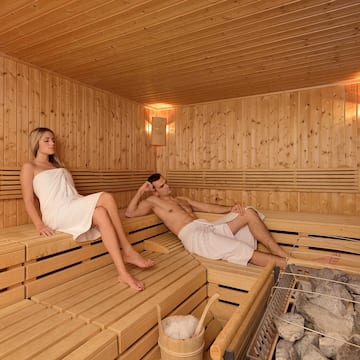 a man and woman in a sauna