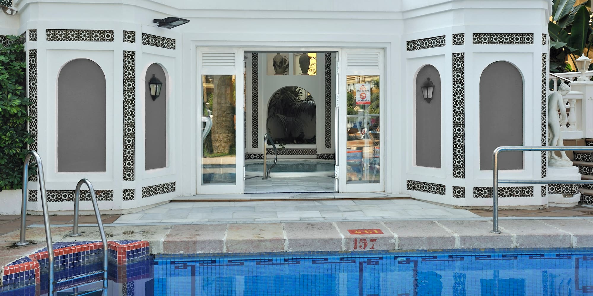 a pool with a building in the background