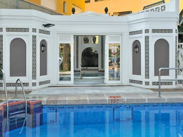 a pool with a building in the background