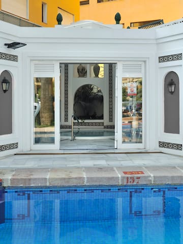 a pool with a building in the background