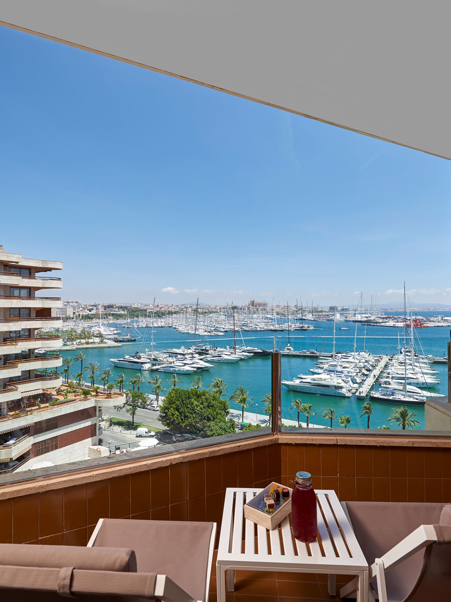 a balcony with a view of a city and water