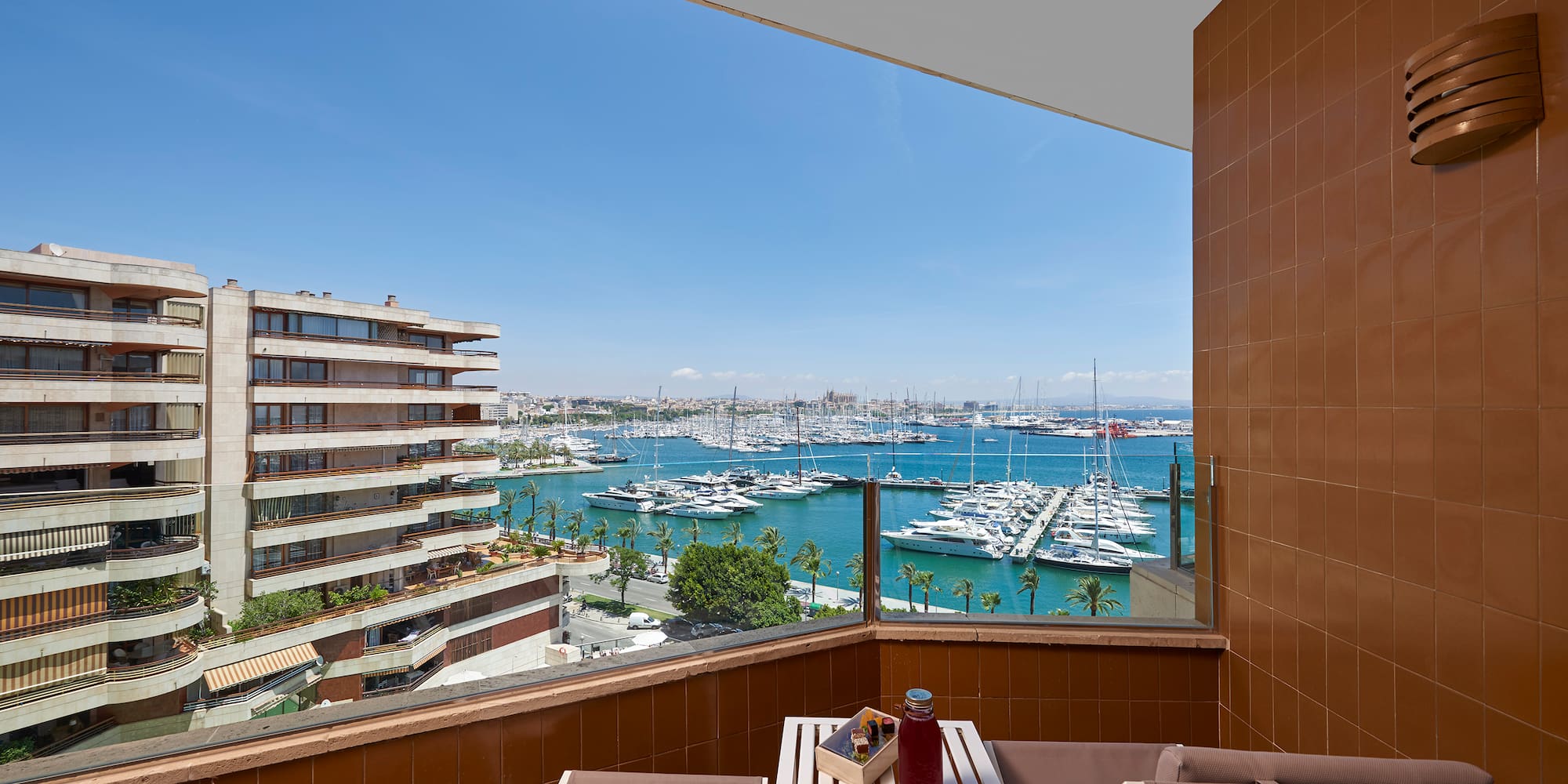 a balcony with a view of a city and water