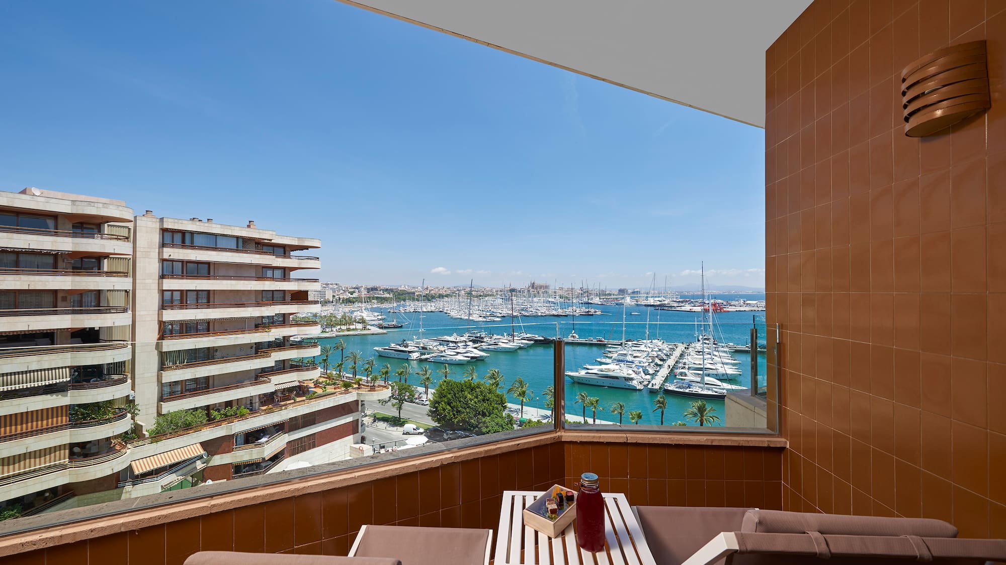a balcony with a view of a city and water