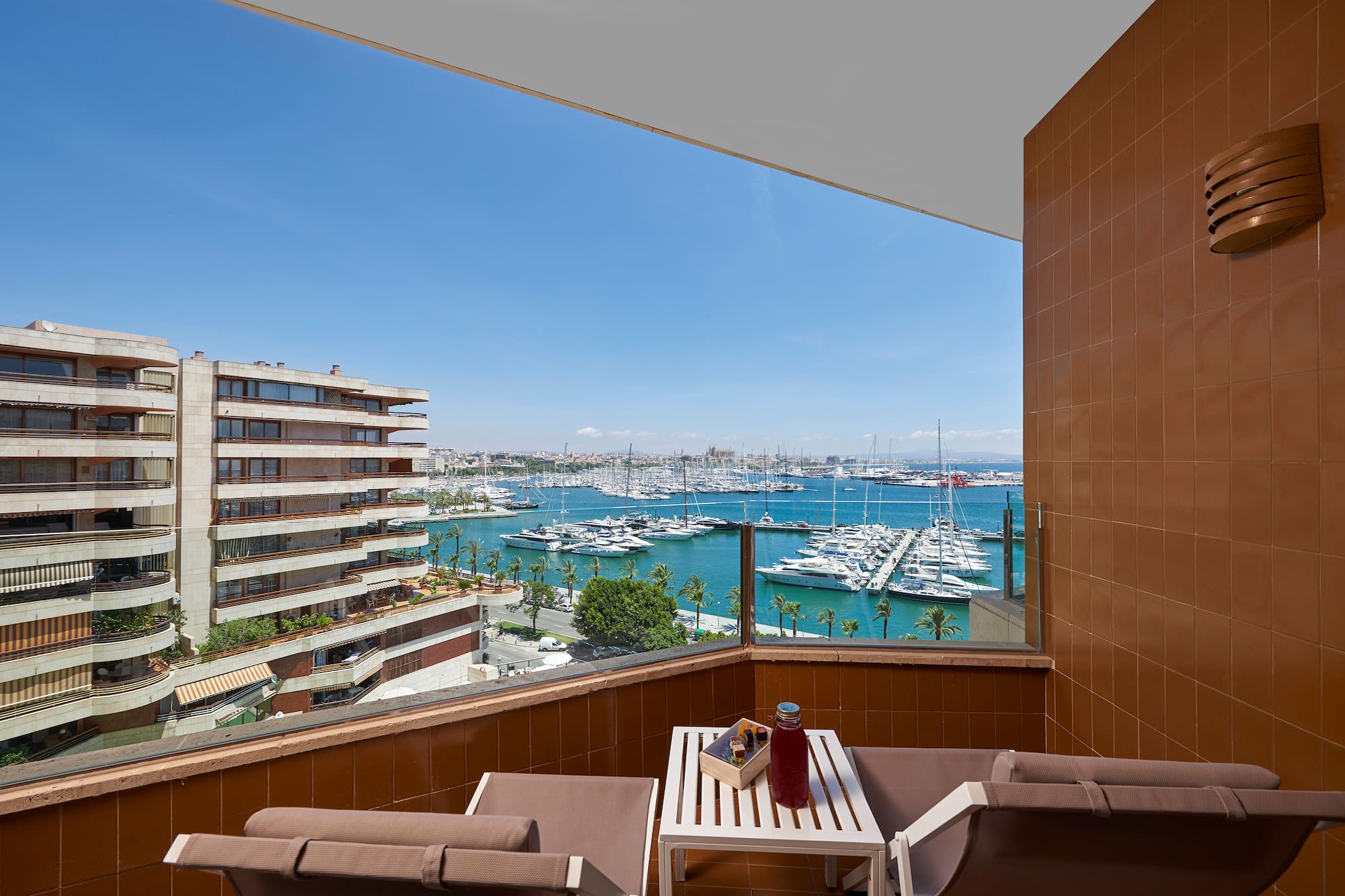a balcony with a view of a city and water