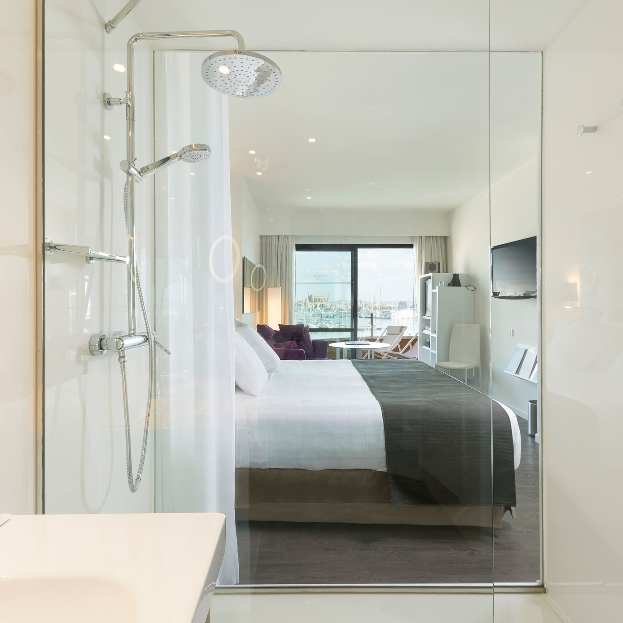 a bathroom with a bed and shower