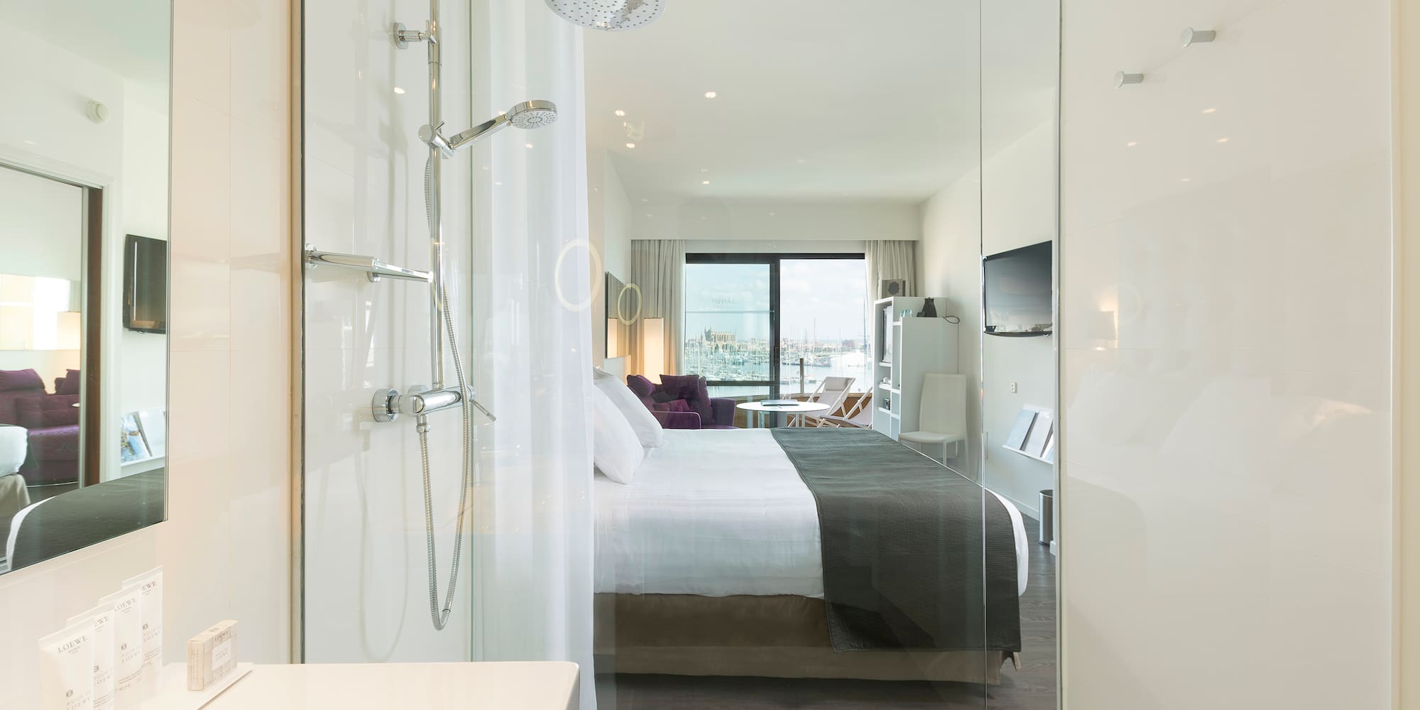 a bathroom with a bed and shower