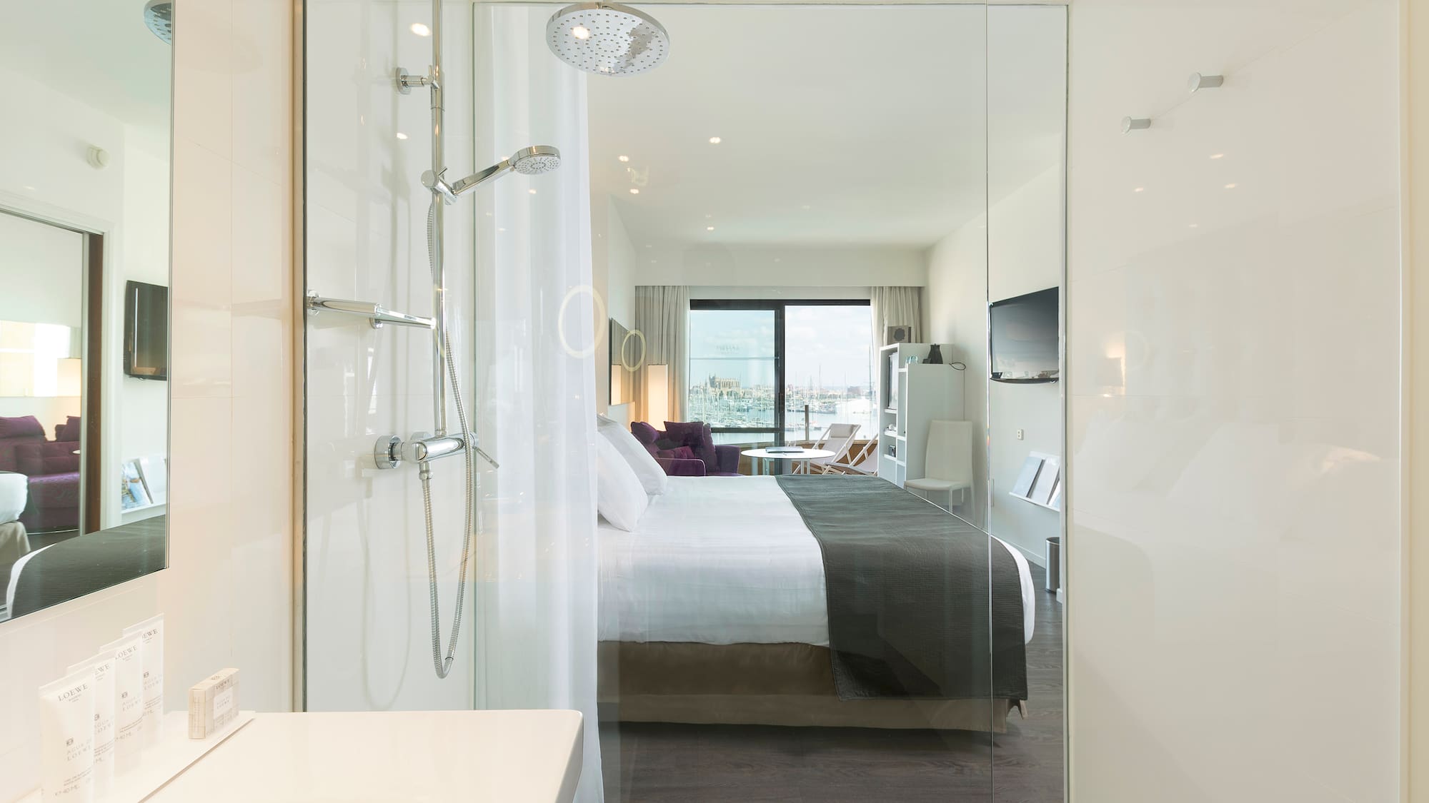 a bathroom with a bed and shower