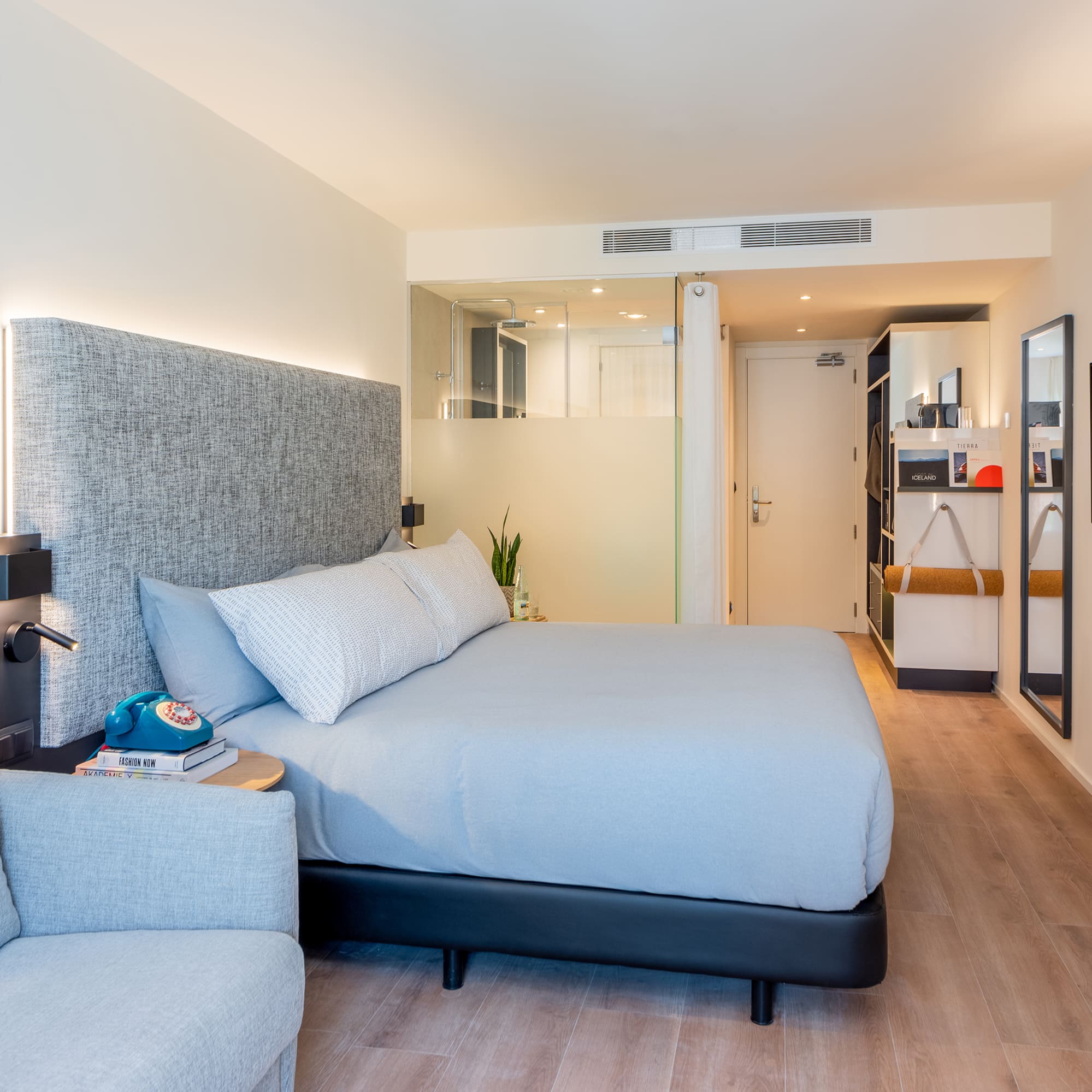 a bedroom with a bed and a couch