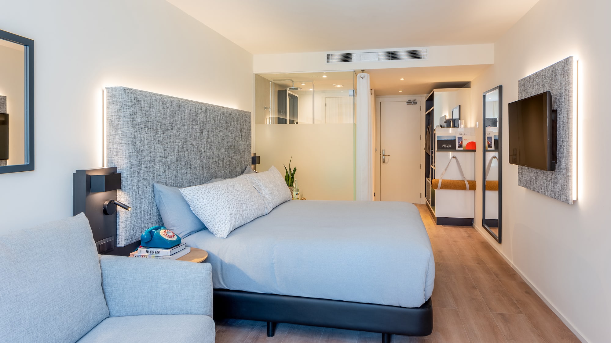 a bedroom with a bed and a couch