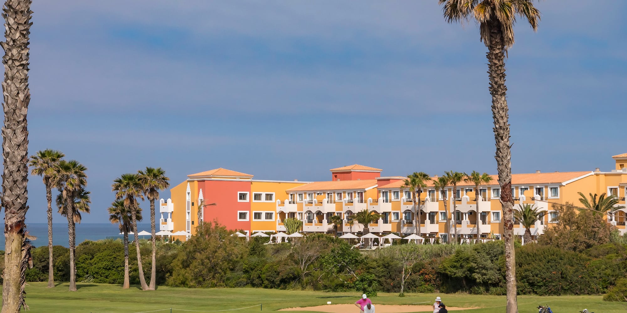 a group of people on a golf course