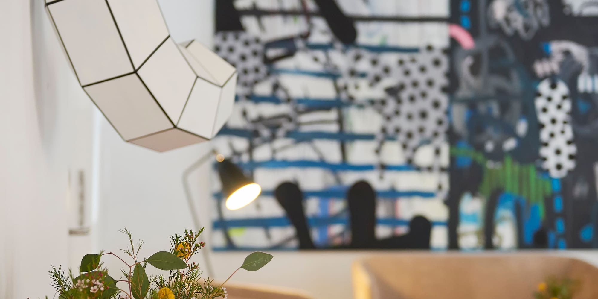 a room with a couch and a painting