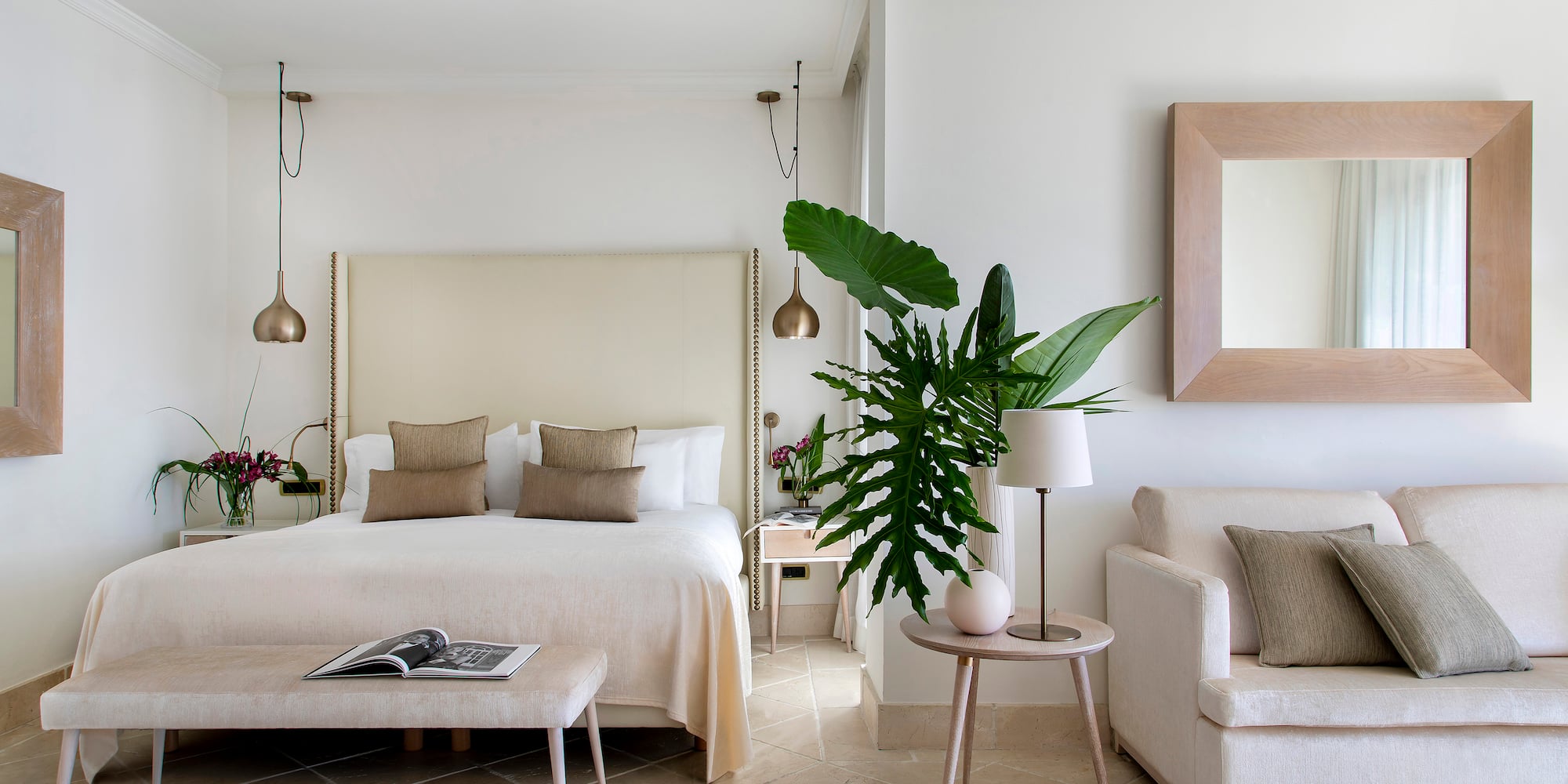 a bedroom with a bed and a couch