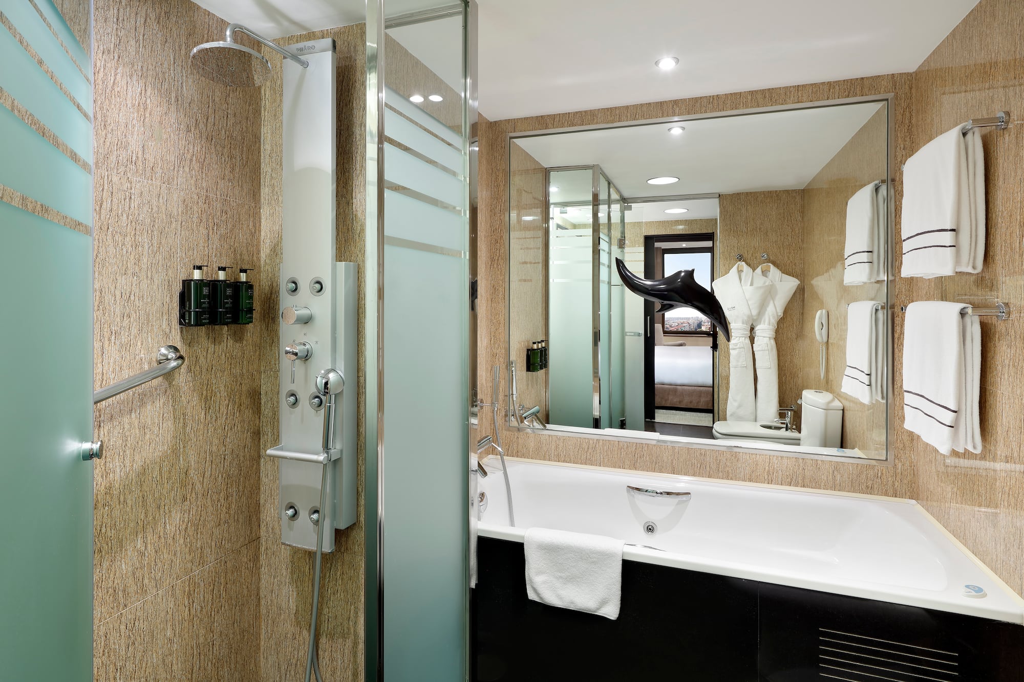 a bathroom with a shower and bathtub
