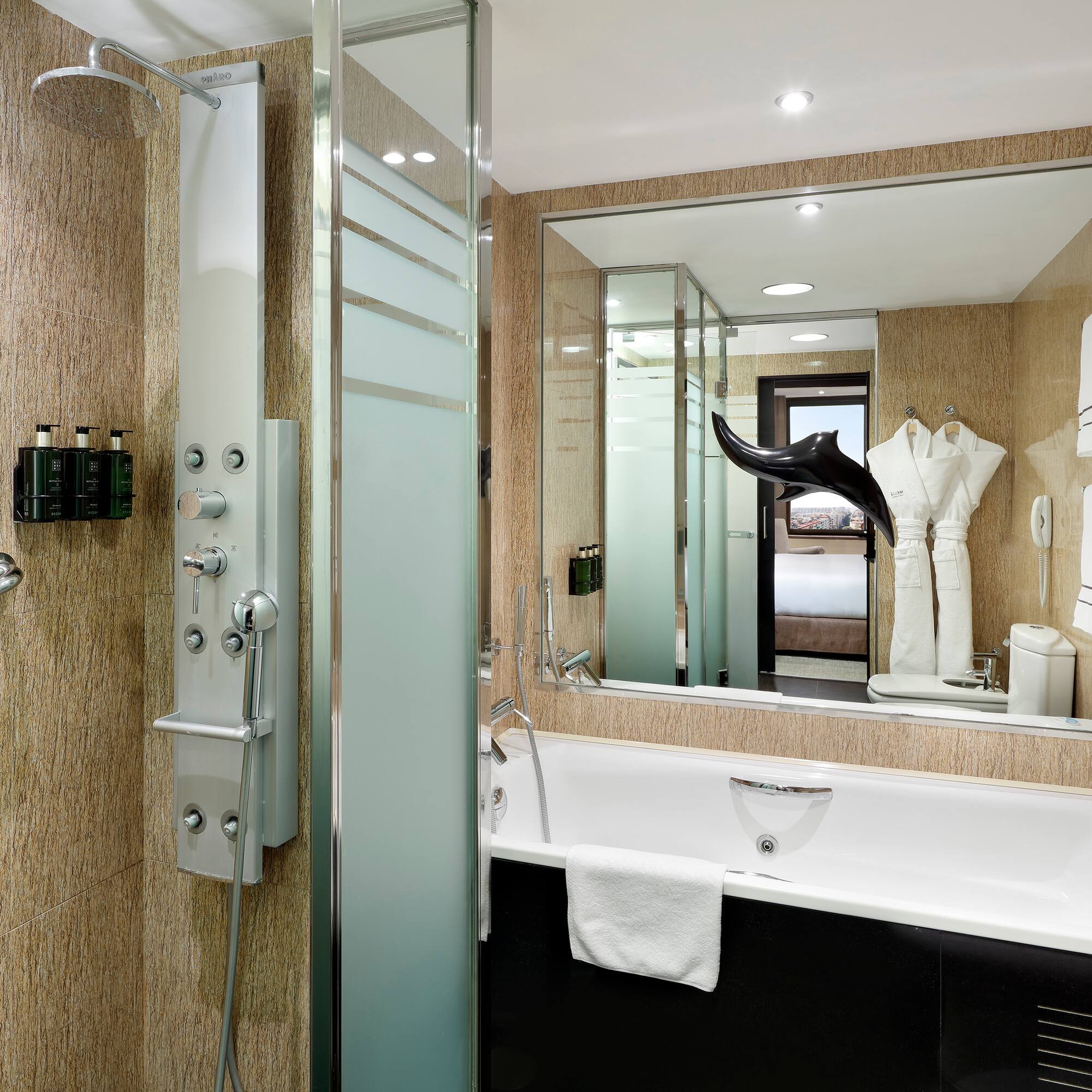 a bathroom with a shower and bathtub
