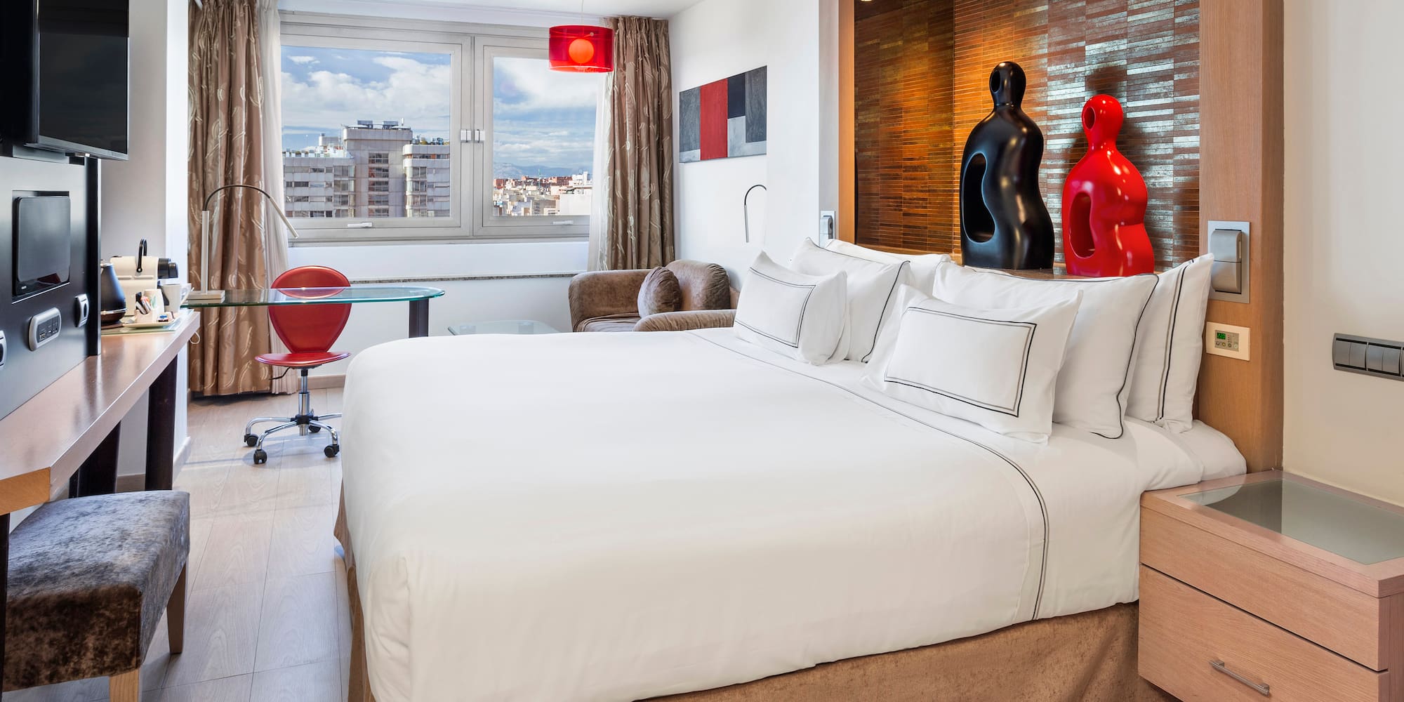 a bedroom with a bed and a table