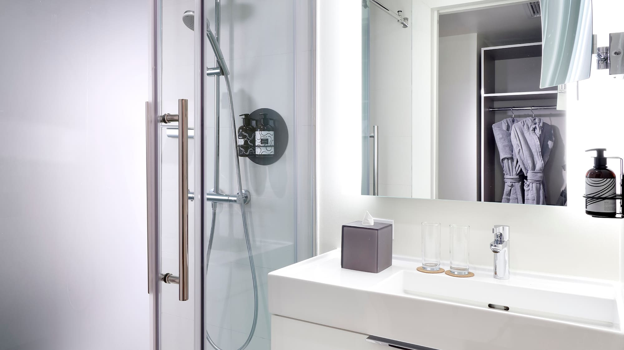 a bathroom with a shower and sink