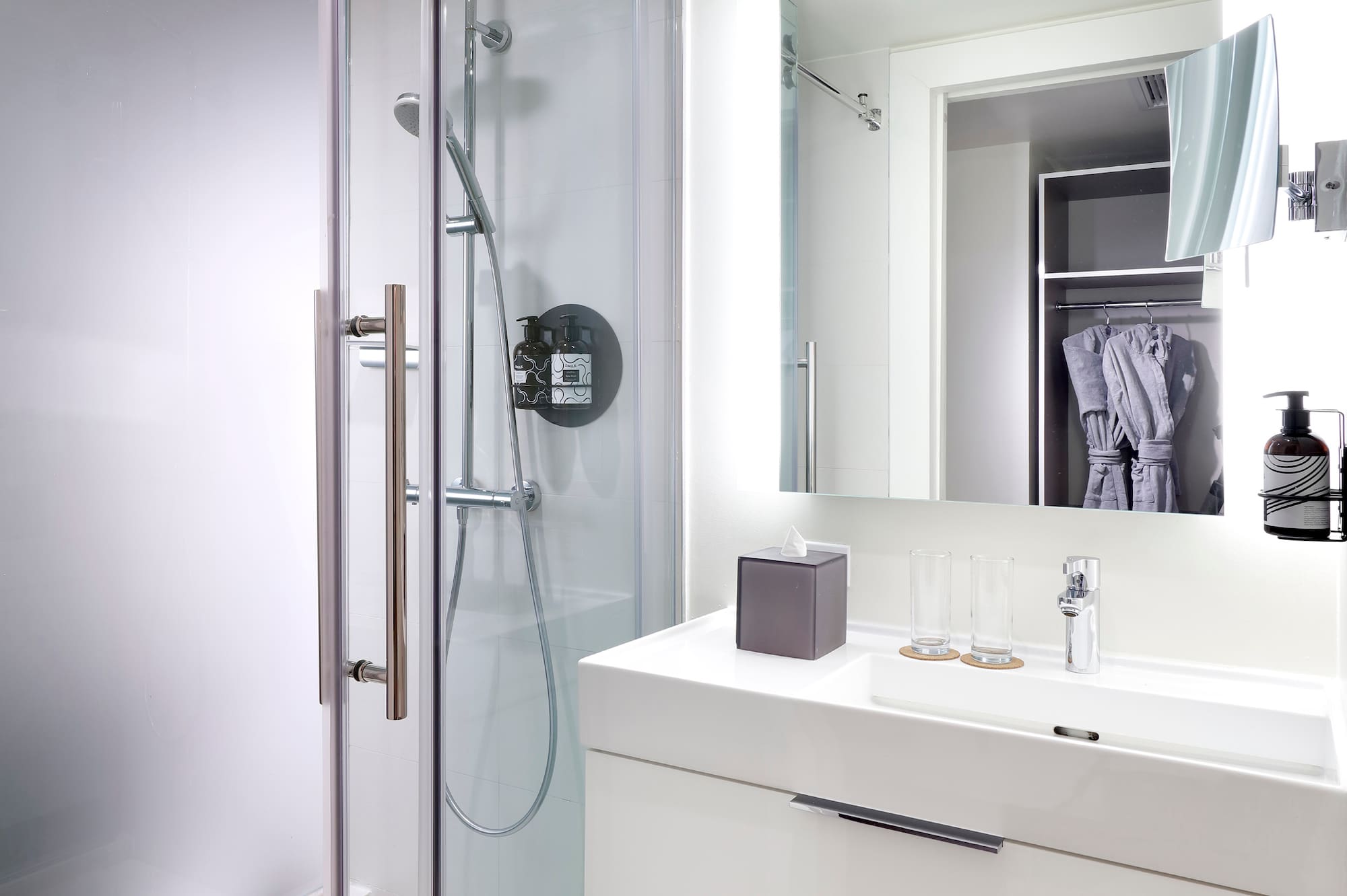 a bathroom with a shower and sink