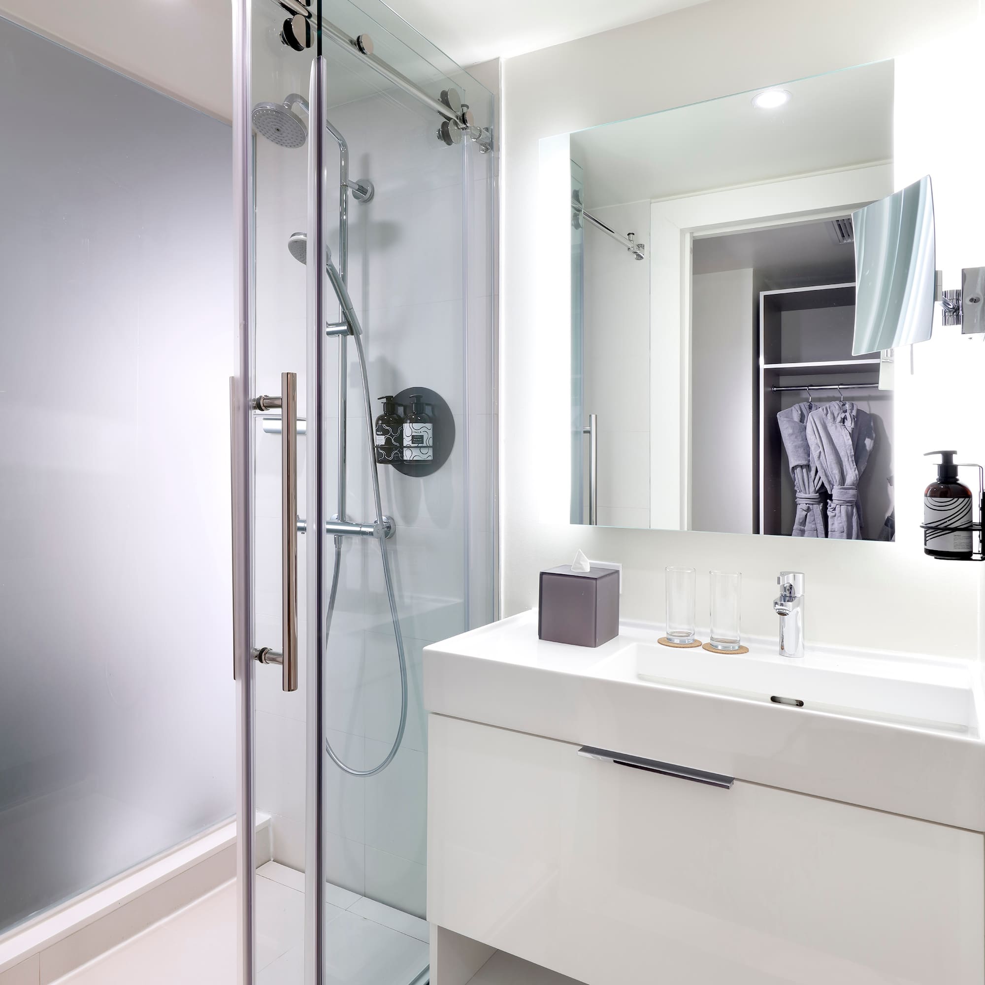 a bathroom with a shower and sink