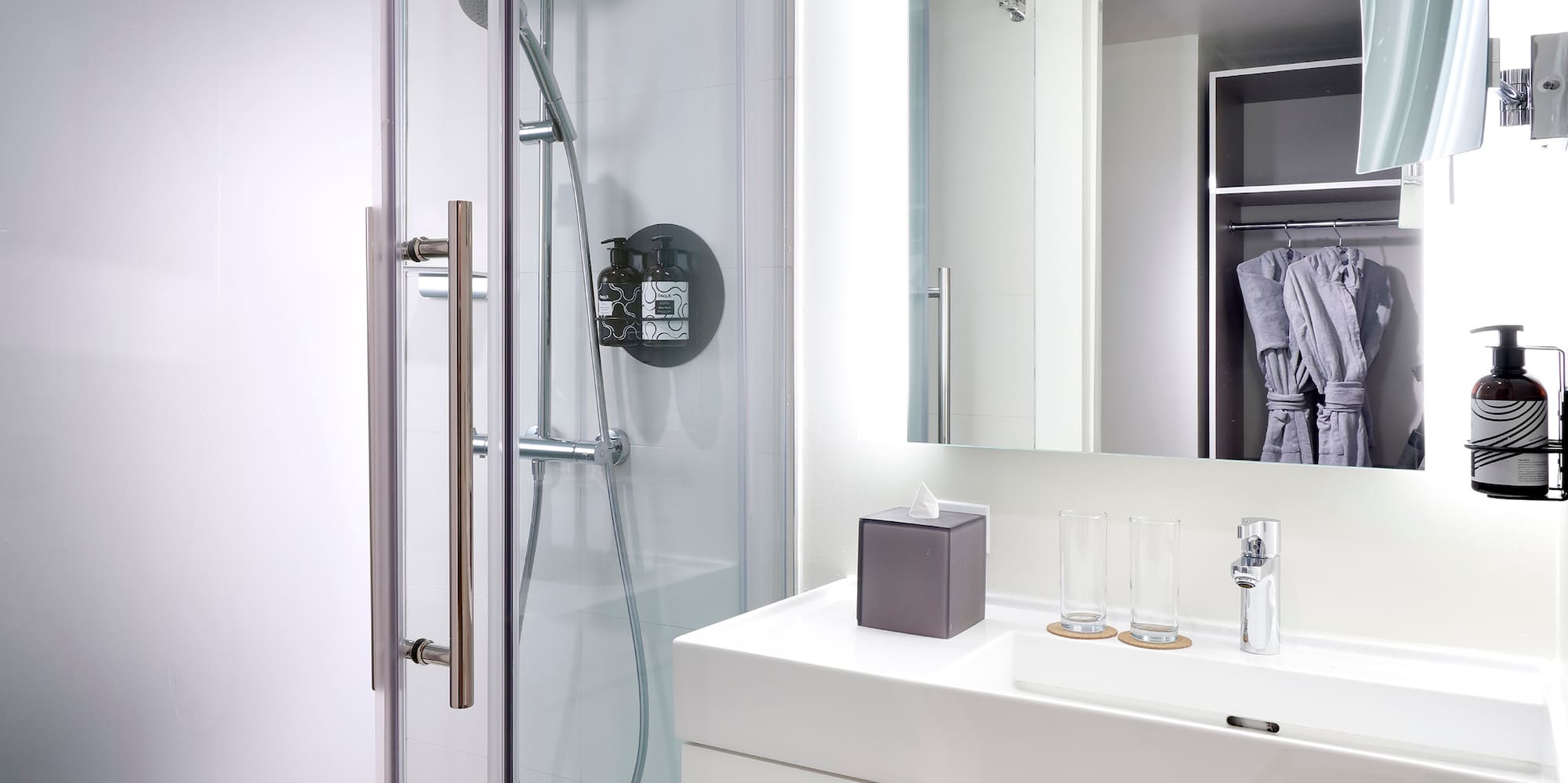 a bathroom with a shower and sink