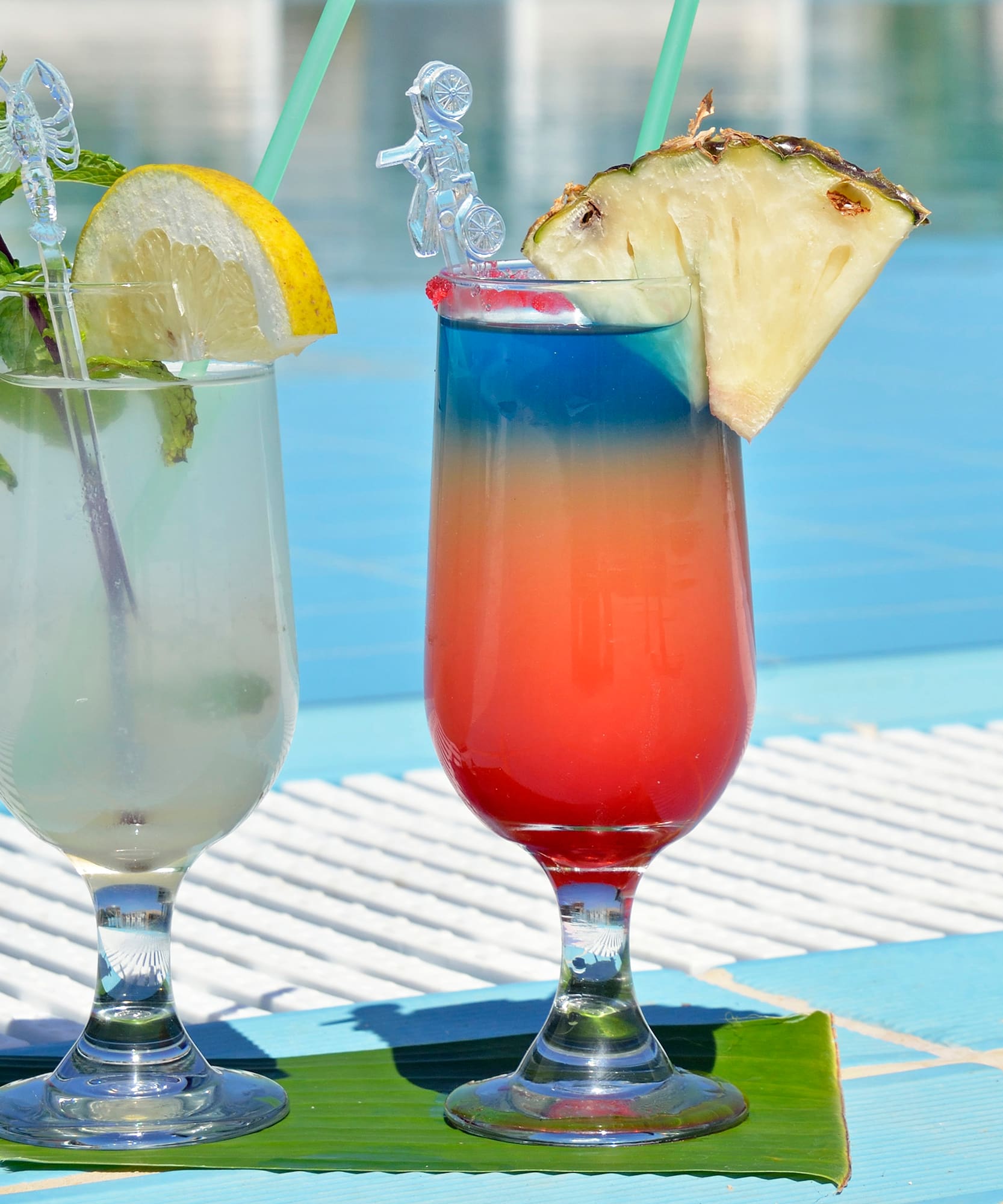 two glasses with drinks on a table